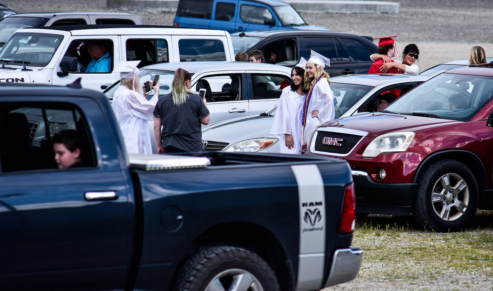 Madison High School drive-thru graduation ceremony at Land of Illusion