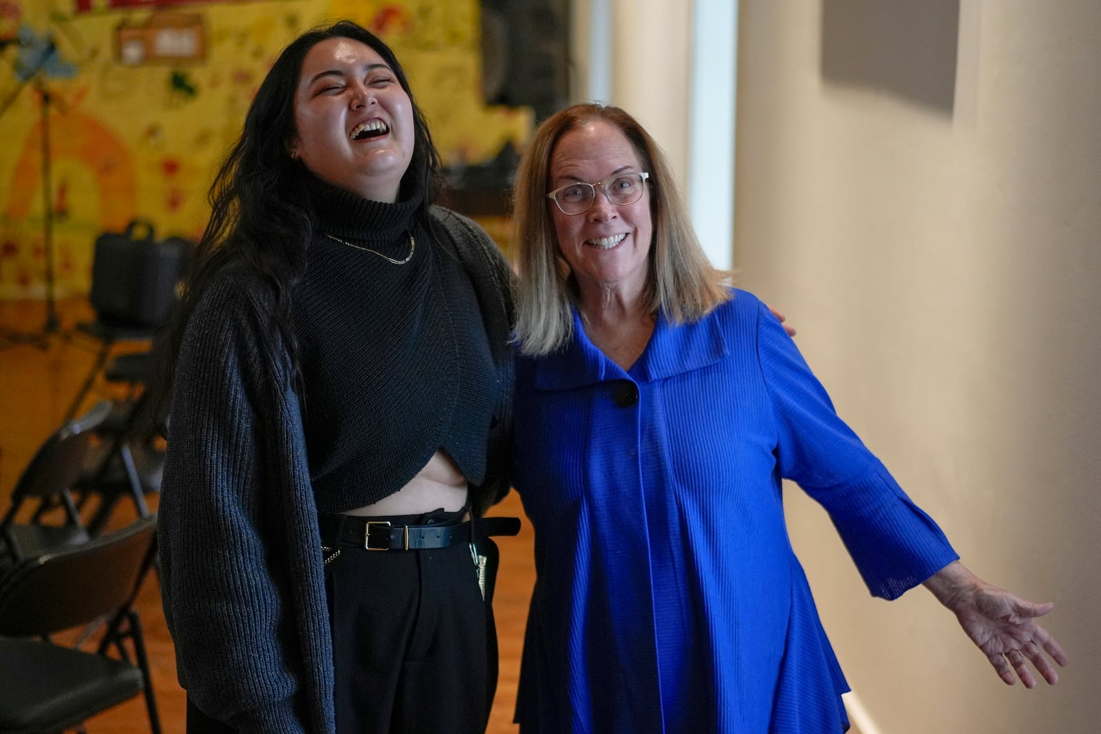 Antioch College student Ahri Morales-Yoon, left, and Antioch College President Jane Fernandes laugh together, Thursday, Feb.13, 2025, at Antioch College in Yellow Springs, Ohio. (AP Photo/Carolyn Kaster)