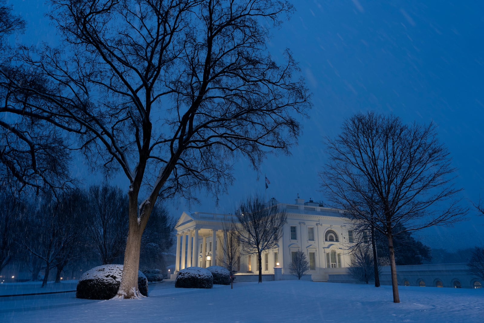 The White House is seen as the snow falls, Tuesday, Feb. 11, 2025, in Washington. (Photo/Alex Brandon)