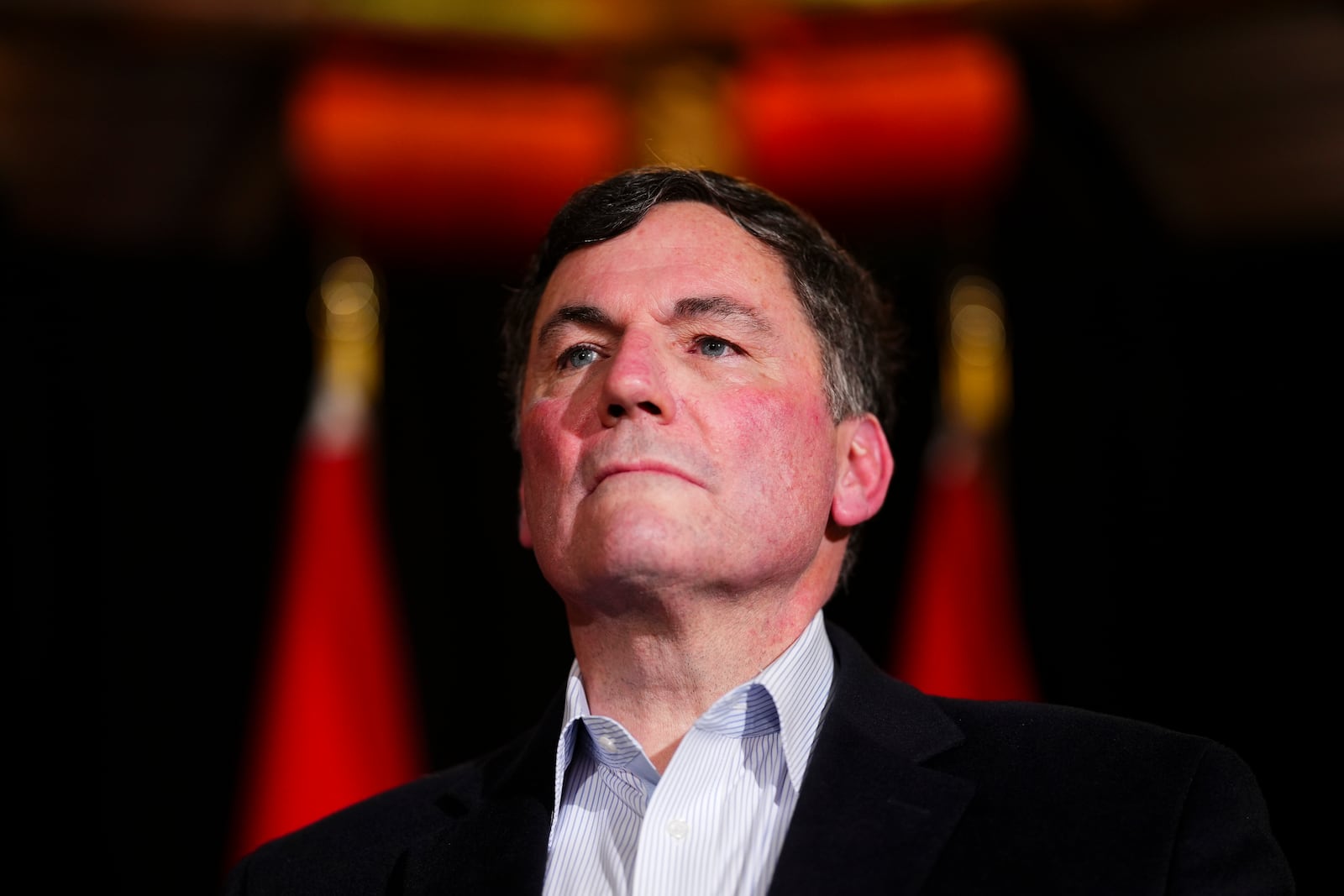 Canada's Minister of Finance and Intergovernmental Affairs Dominic LeBlanc speak to reporters prior to a meeting during a cabinet retreat at Chateau Montebello in Montebello, Quebec, Monday, Jan. 20, 2025. (Sean Kilpatrick/The Canadian Press via AP)