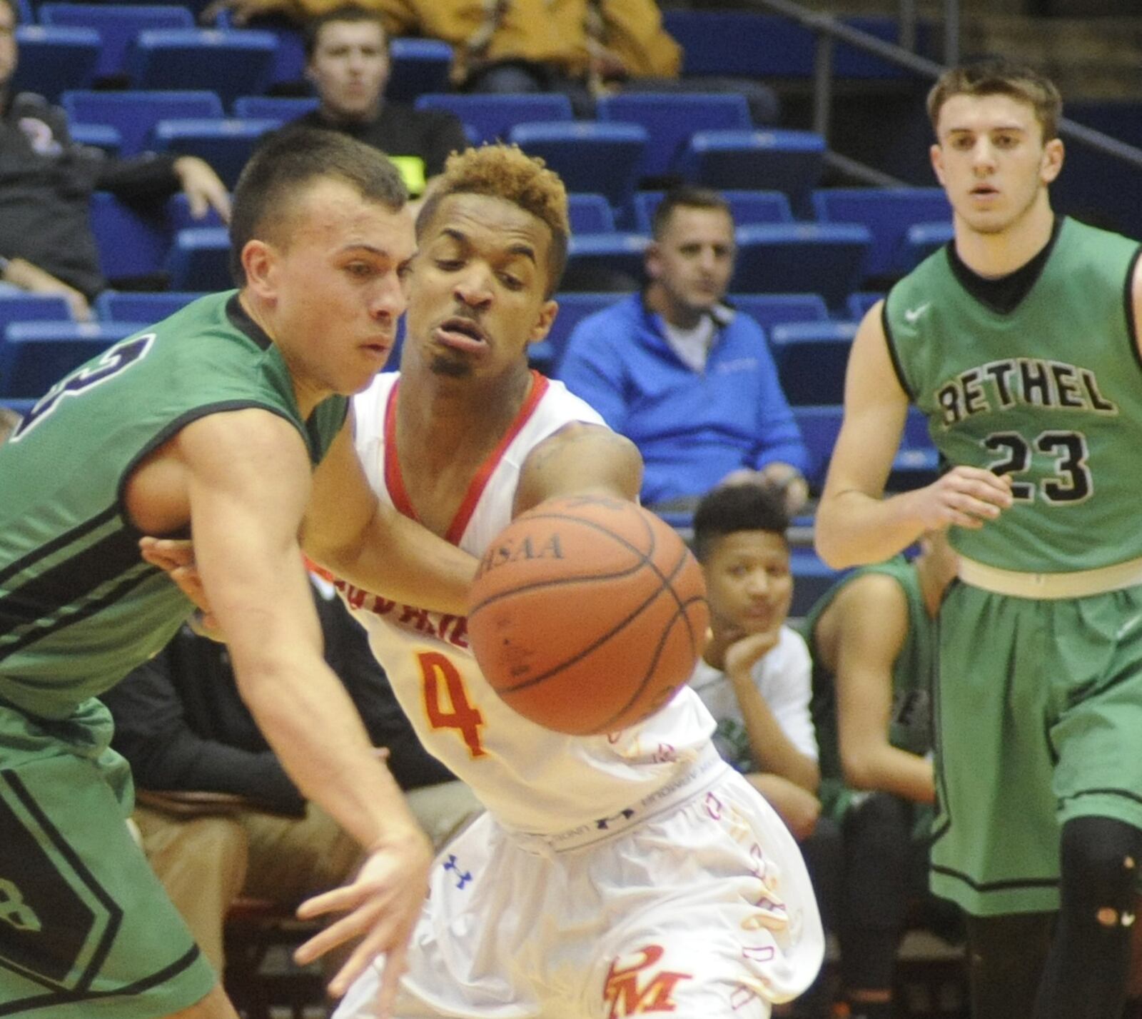 Purcell Marian’s Josh Mahan battles Tipp City Bethel’s Caleb South for the ball during a Division III district final at the University of Dayton Arena on March 2, 2016. MARC PENDLETON/STAFF