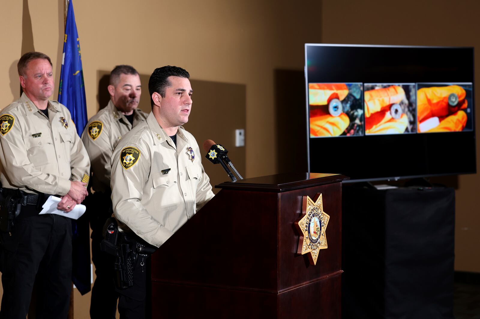 Metropolitan Police Department Assistant Sheriff Dori Koren shows a photo of bullet casings found in a Tesla Cybertruck that exploded at the Trump International Hotel on New Year's Day, during a news conference at the department headquarters in Las Vegas, Tuesday, Jan. 7, 2025, (K.M. Cannon/Las Vegas Review-Journal via AP)