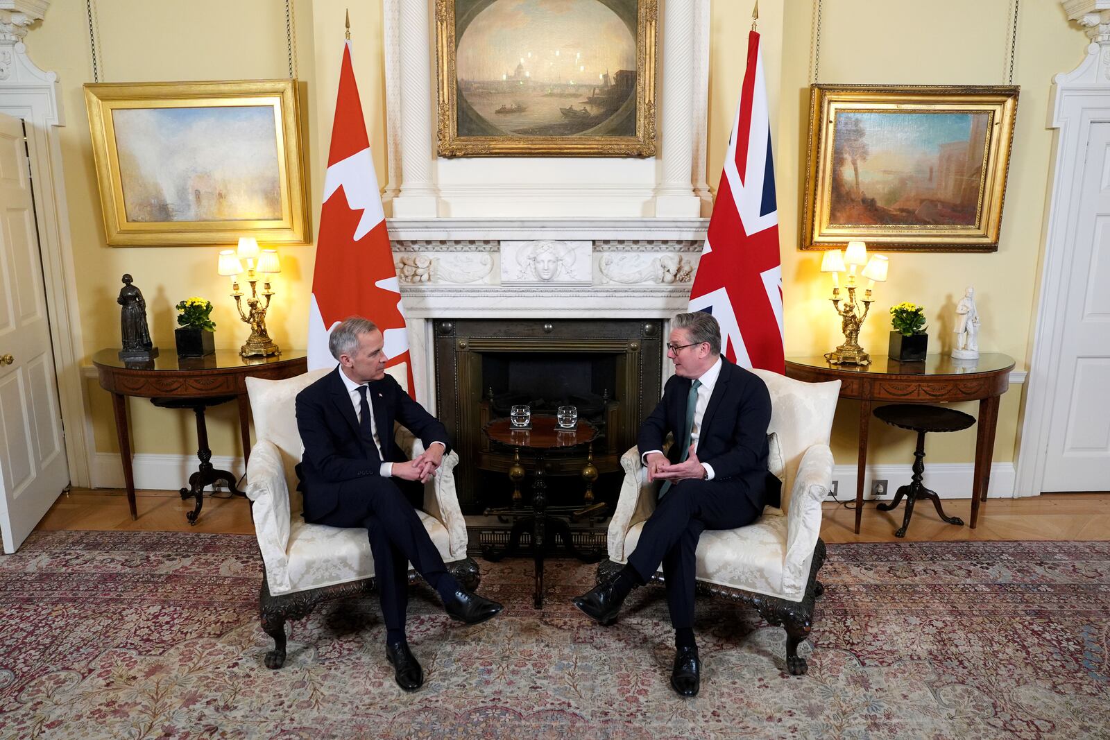 Britain's Prime Minister Sir Keir Starmer, right, and Canada's Prime Minister Mark Carney, left, attend a meeting in 10 Downing Street, London, England, Monday March 17, 2025. (Jordan Pettitt/PA via AP, Pool)