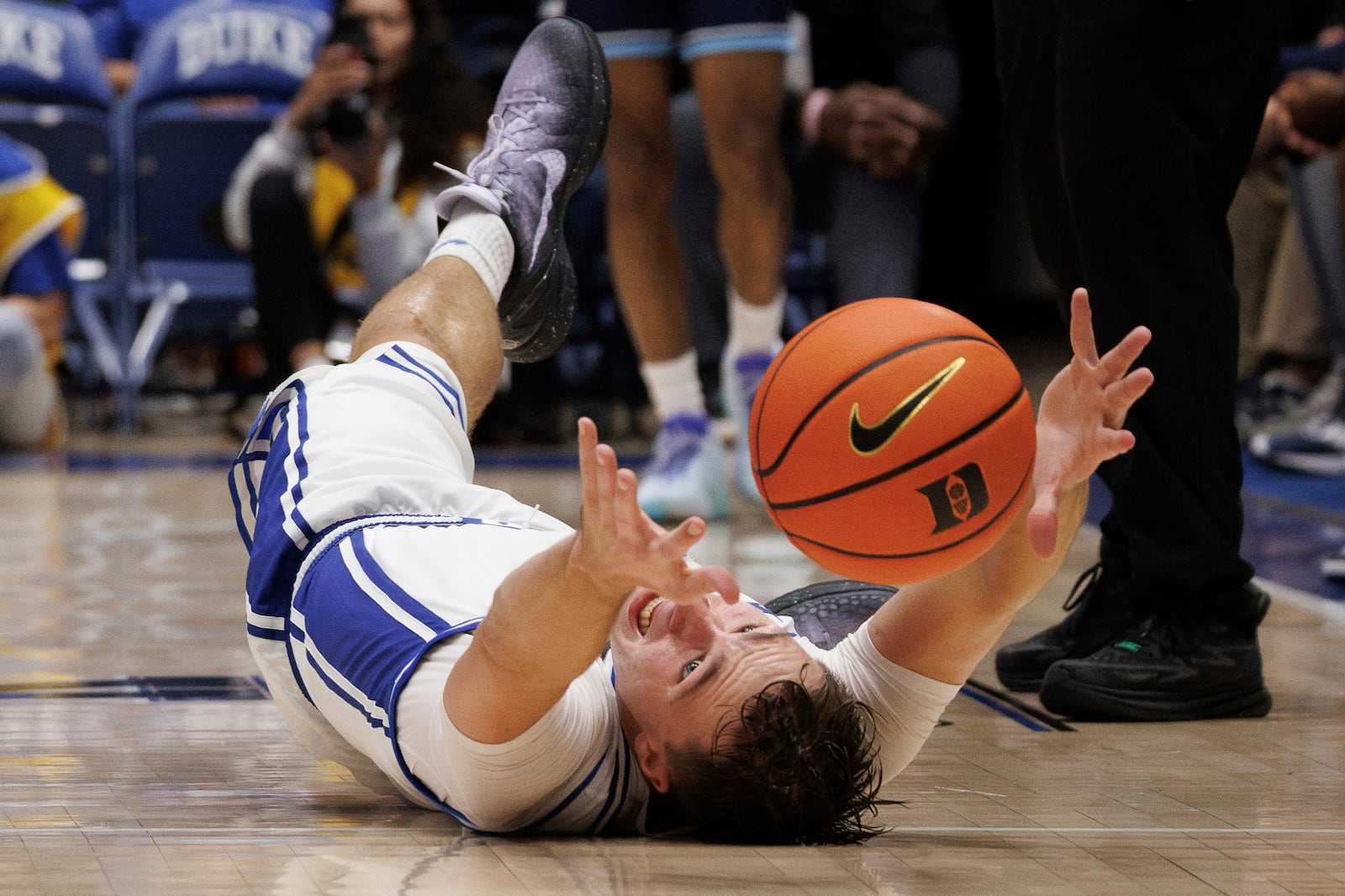 Duke's Cooper Flagg (2) dives for a loose ball during the second half of an NCAA college basketball game against Maine in Durham, N.C., Monday, Nov. 4, 2024. (AP Photo/Ben McKeown)