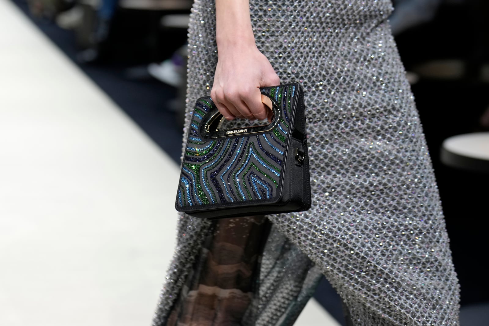 A model wears a creation as part of the Giorgio Armani Fall/Winter 2025-2026 Women's collection presented in Milan, Italy, Sunday, March 2, 2025. (AP Photo/Luca Bruno)