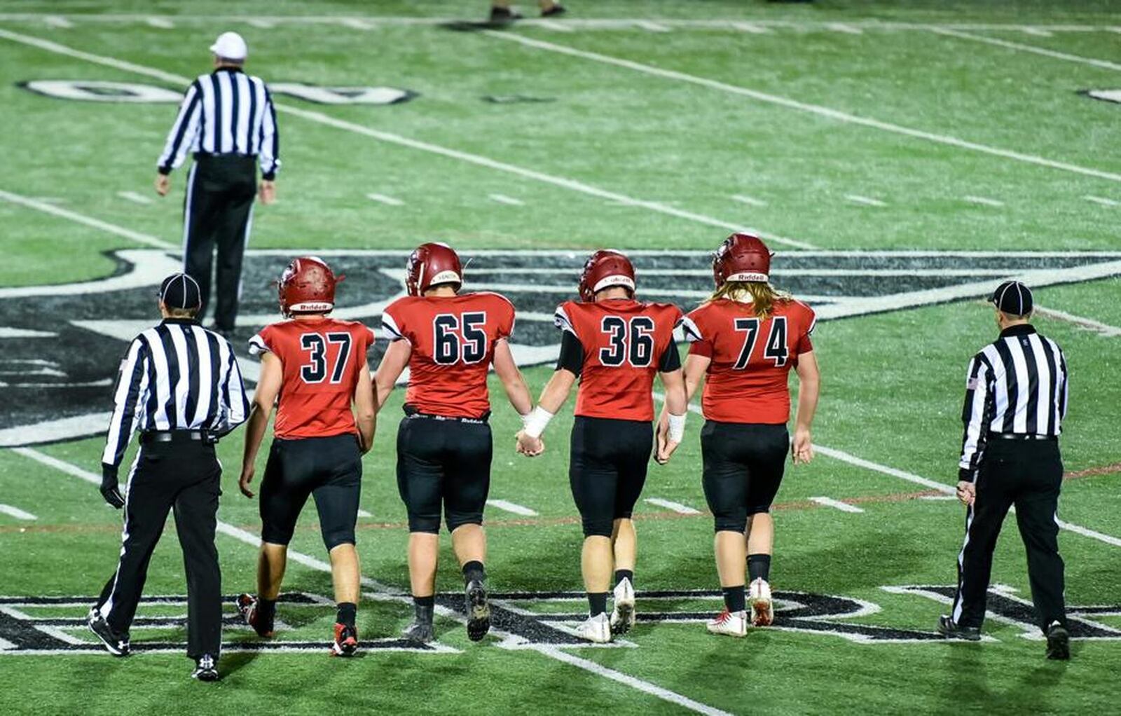 Madison’s Tanner Limon (37), Stephen Watts (65), Cole Pelgen (36) and Caleb Bolen (74) prepare to get to work against Cincinnati Hills Christian Academy on Nov. 10 in a Division V, Region 20 semifinal at Lakota East. NICK GRAHAM/STAFF