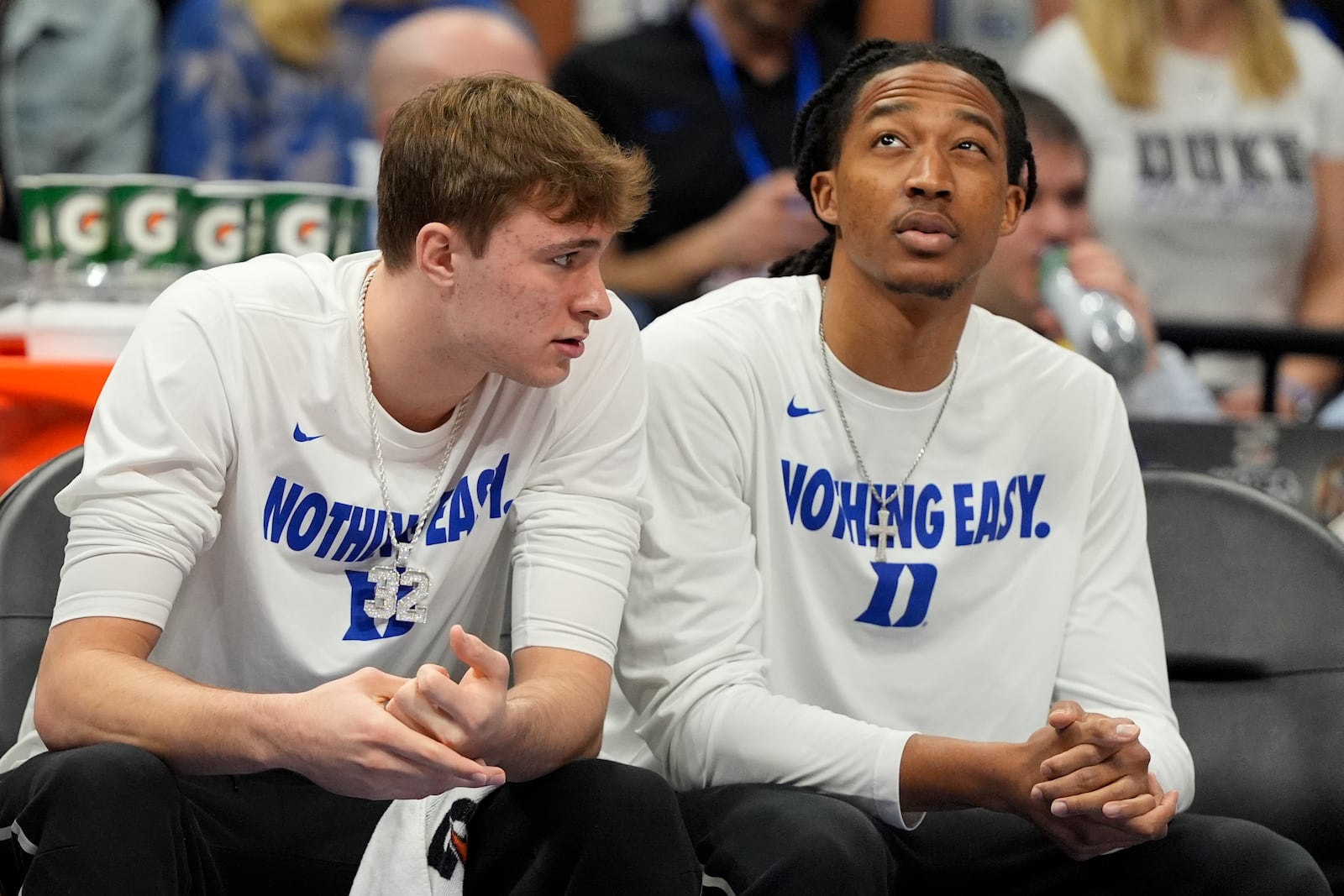 Duke forward Cooper Flagg, left, and forward Maliq Brown watch during the first half of NCAA college basketball game against Louisville in the championship of the Atlantic Coast Conference tournament, Saturday, March 15, 2025, in Charlotte, N.C. (AP Photo/Chris Carlson)