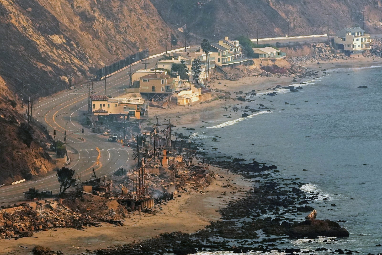 Beach front properties are left destroyed by the Palisades Fire, in this aerial view, Thursday, Jan. 9, 2025 in Malibu, Calif. (AP Photo/Mark J. Terrill)