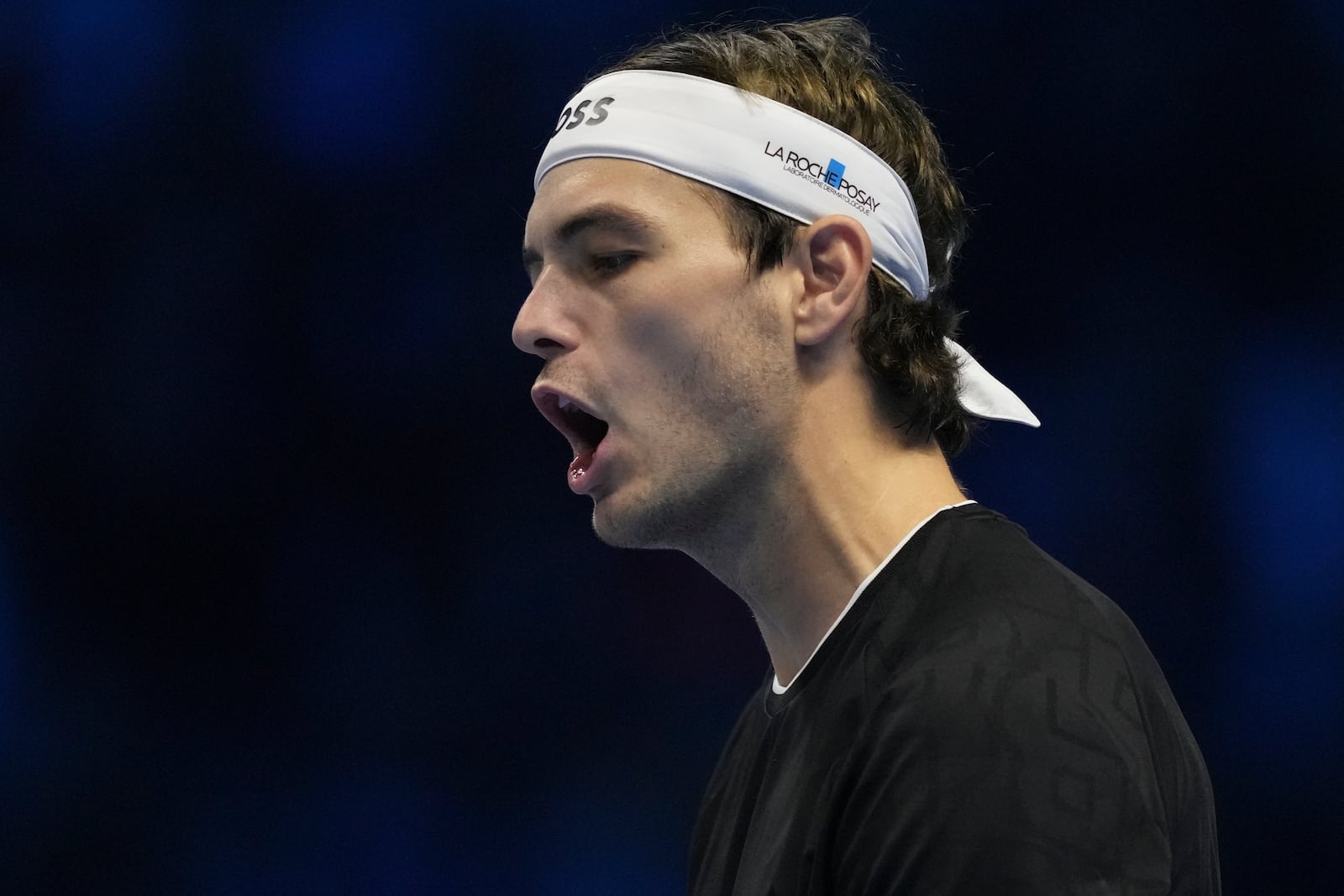 Taylor Fritz of the United States reacts during the final match of the ATP World Tour Finals against Italy's Jannik Sinner at the Inalpi Arena, in Turin, Italy, Sunday, Nov. 17, 2024. (AP Photo/Antonio Calanni)