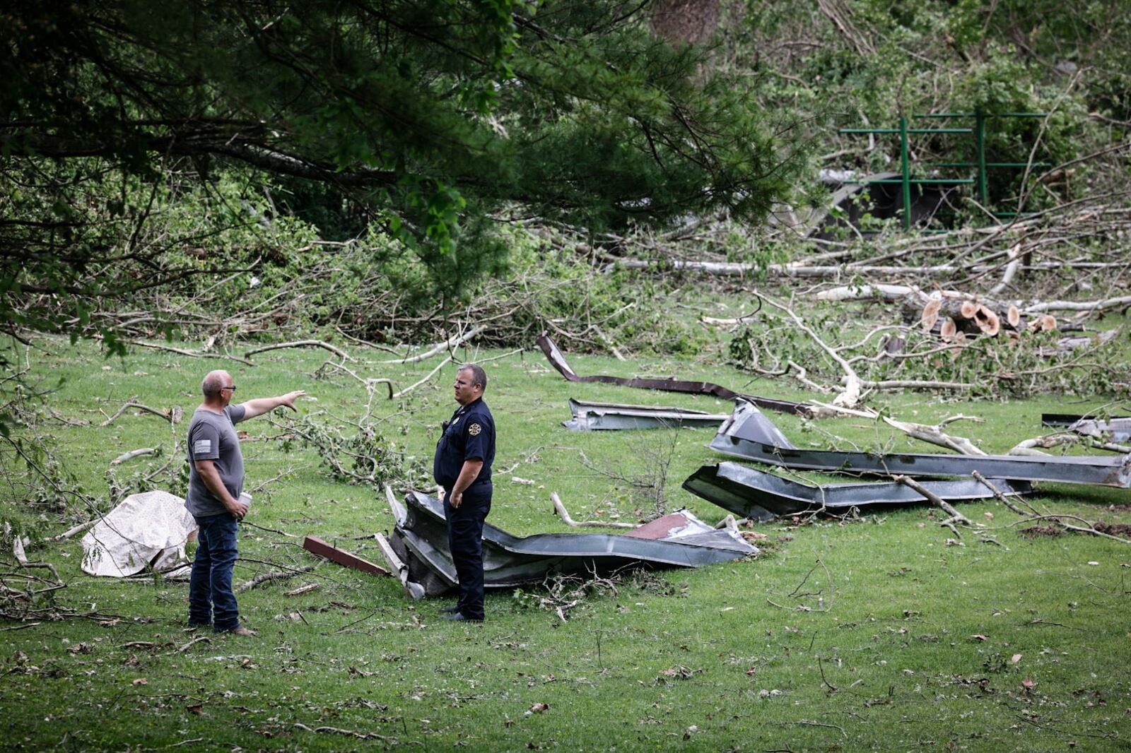 Salem Morrow Fire Chief William Harrison, left and assistant chief John Moenster survey damage Thursday, May 9, 2024, along Mason-Morrow-Milgrove Road in Warren County after five tornadoes hit Warren County on May 7. JIM NOELKER/STAFF