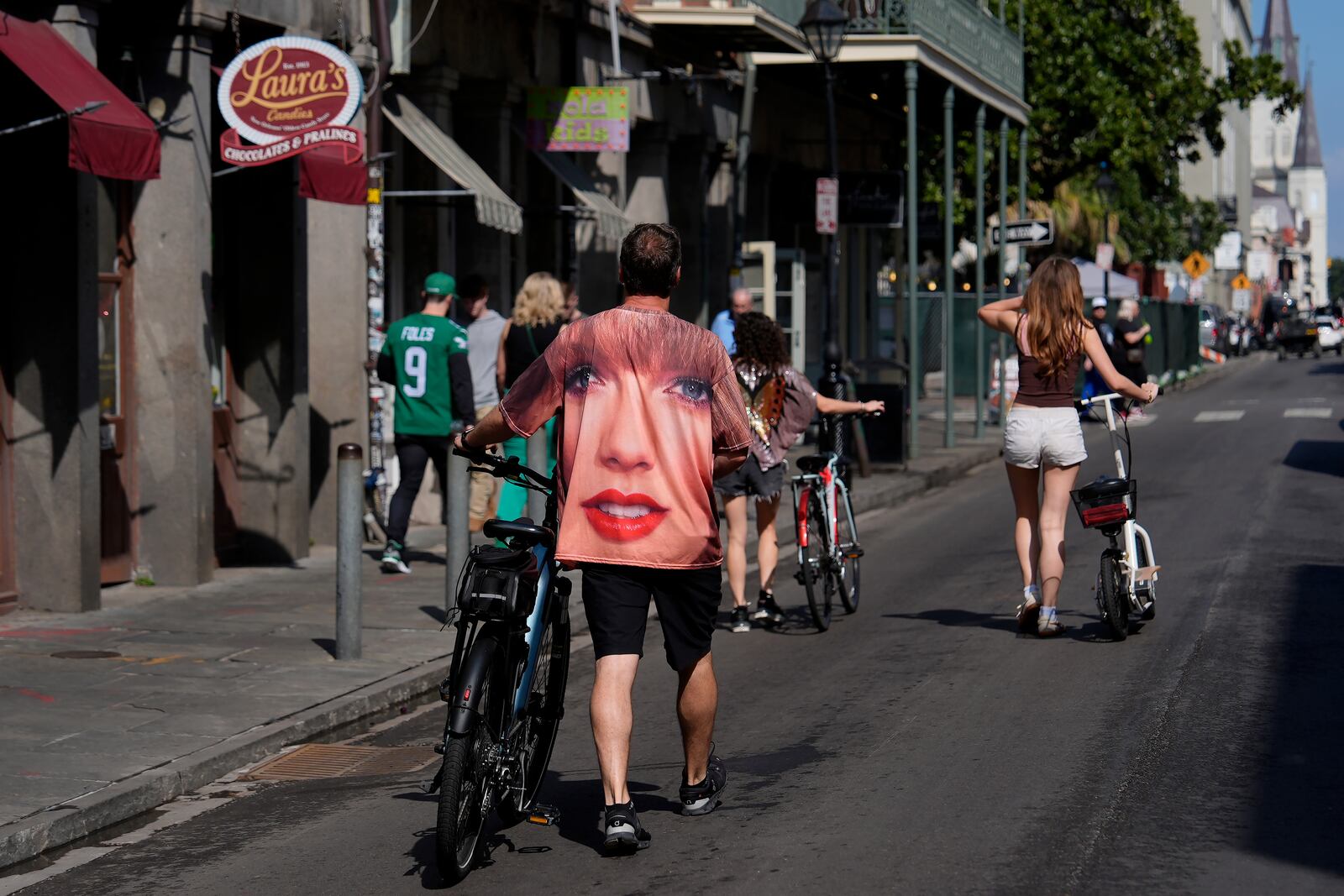 A person wearing a Taylor Swift shirt walks in the French Quarter before the NFL Super Bowl 59 football game between the Kansas City Chiefs and the Philadelphia Eagles, Sunday, Feb. 9, 2025, in New Orleans. (AP Photo/Julia Demaree Nikhinson)