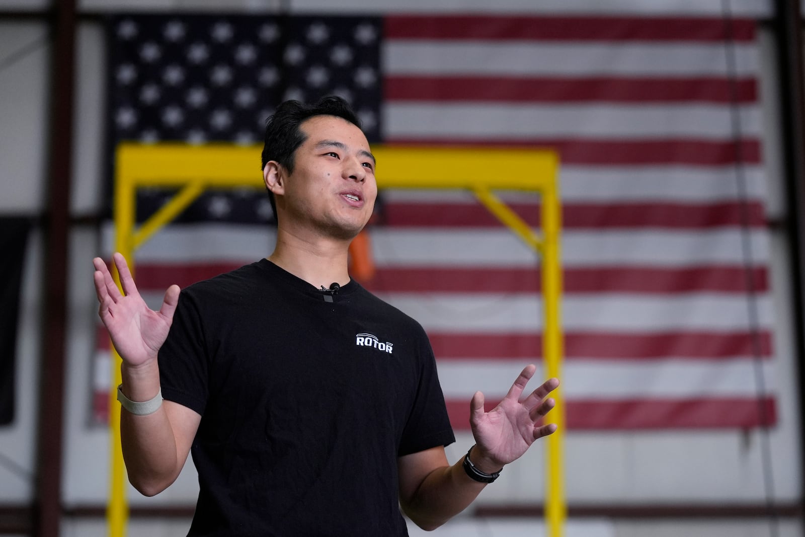 Hector Xu, CEO of Rotor Technologies, gestures during an interview at the company's hanger where unmanned semi-autonomous helicopters are being assembled, Monday, Nov. 11, 2024, in Nashua, N.H. (AP Photo/Charles Krupa)