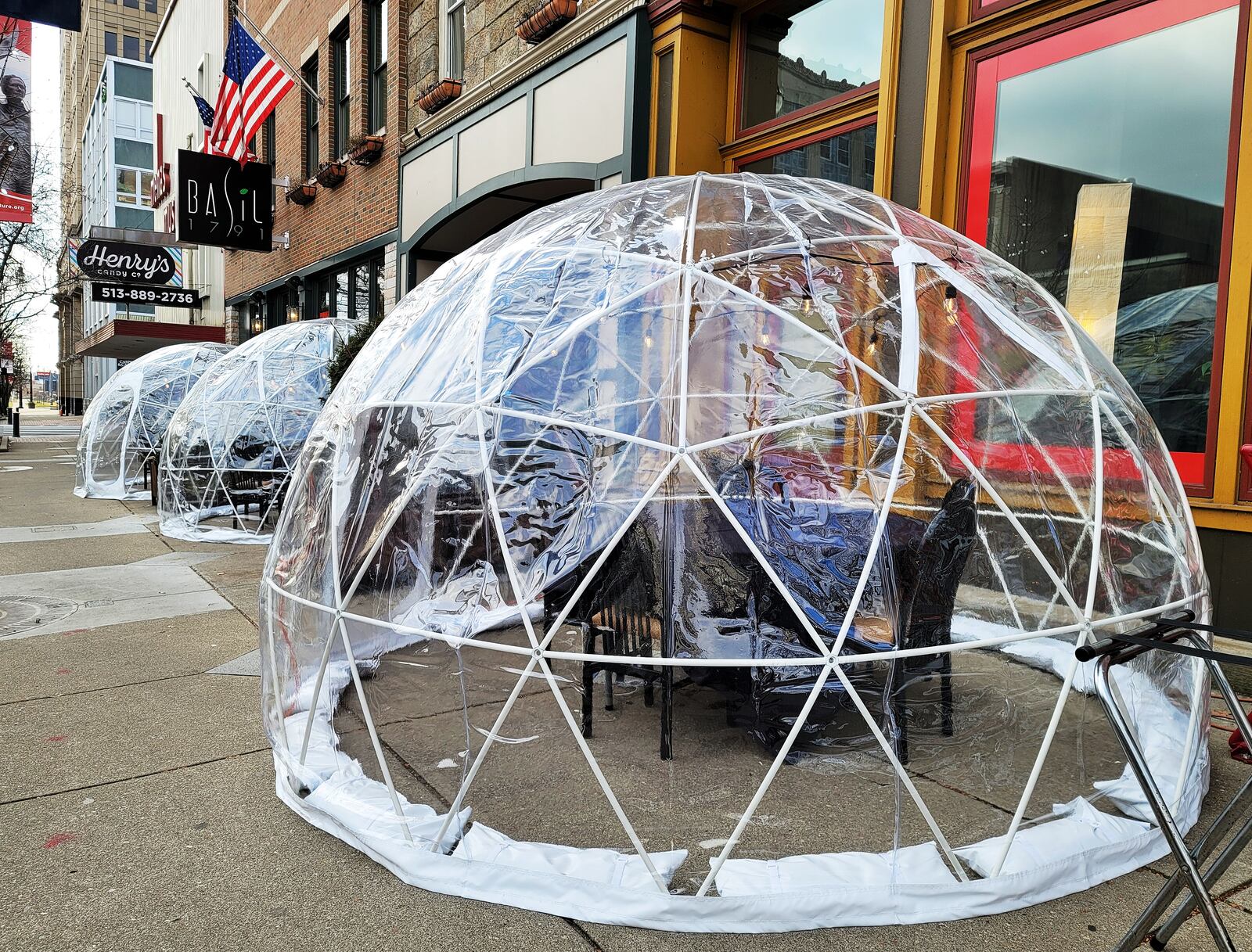 Basil 1791 on High Street in Hamilton has installed igloos for outdoor dining on the sidewalk in front of the restaurant. NICK GRAHAM / STAFF