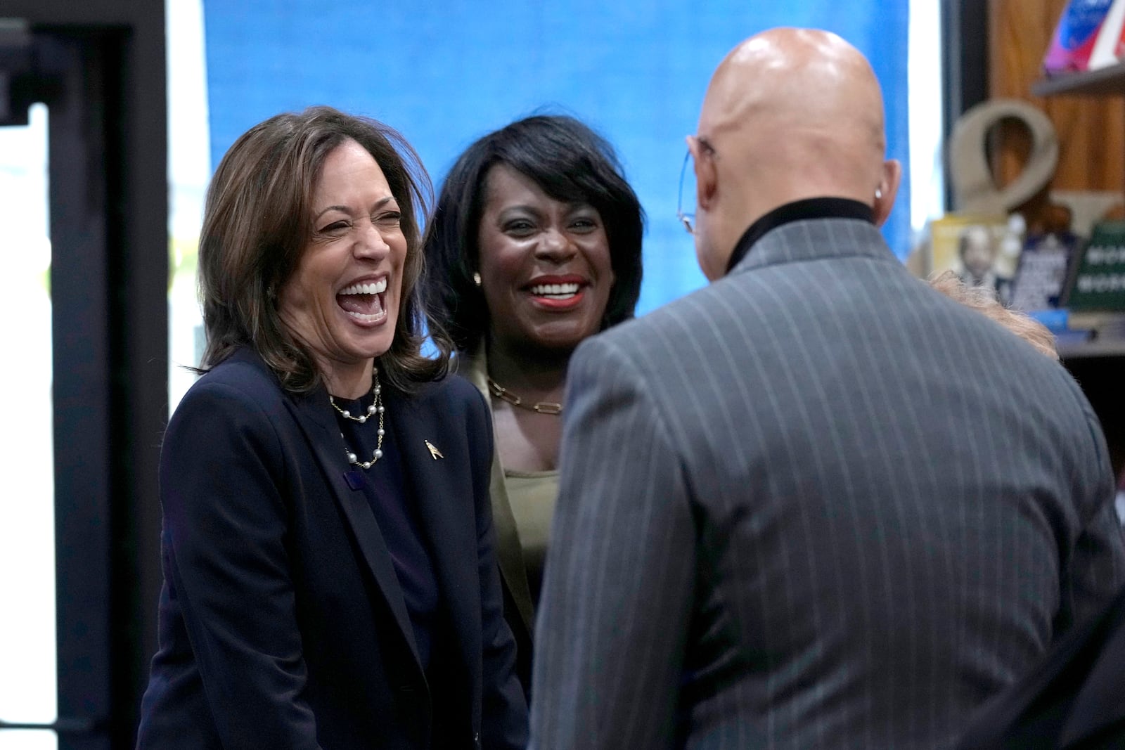 Democratic presidential nominee Vice President Kamala Harris, from left, and Philadelphia Mayor Cherelle Parker visit Hakim's Bookstore and Gift Shop during a campaign stop, Sunday, Oct. 27, 2024, in Philadelphia. (AP Photo/Susan Walsh)