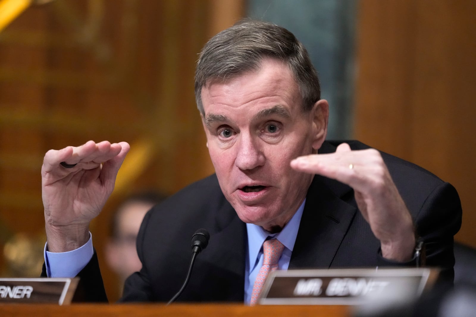 Sen. Mark Warner, D-Va., speaks at the Senate Finance Committee confirmation hearing for Scott Bessent, President-elect Donald Trump's choice to be Secretary of the Treasury, at the Capitol in Washington, Thursday, Jan. 16, 2025. (AP Photo/Ben Curtis)