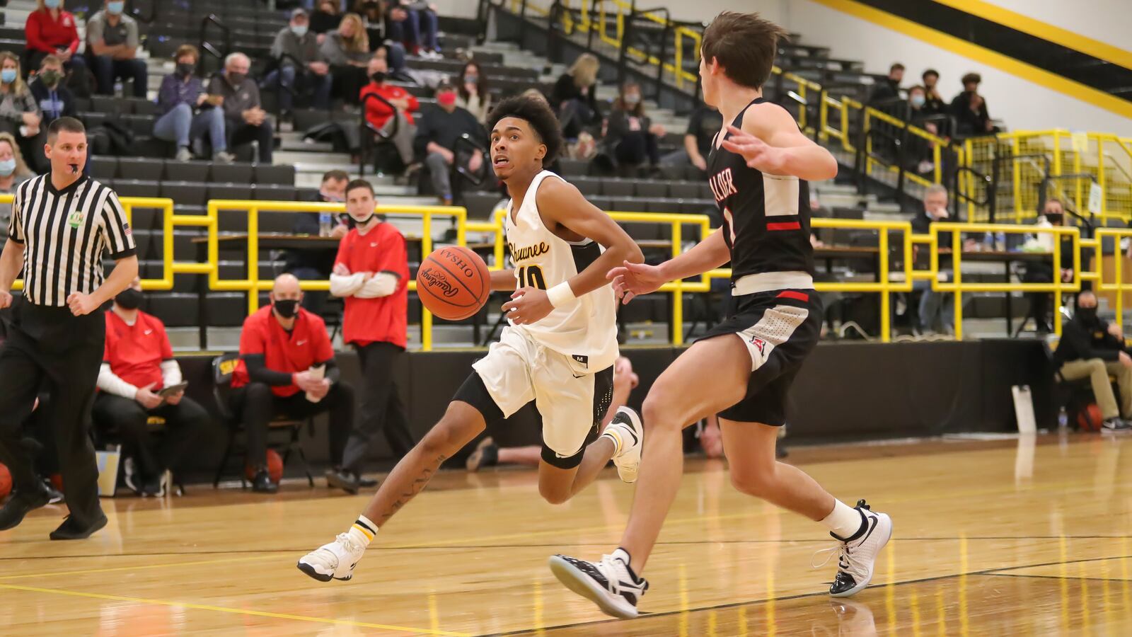 Cutline: Shawnee High School senior Jamon Miller drives past Jonathan Alder junior Grant Welsch during their game on Friday night in Springfield. The Pioneers won 45-44. Michael Cooper/CONTRIBUTED