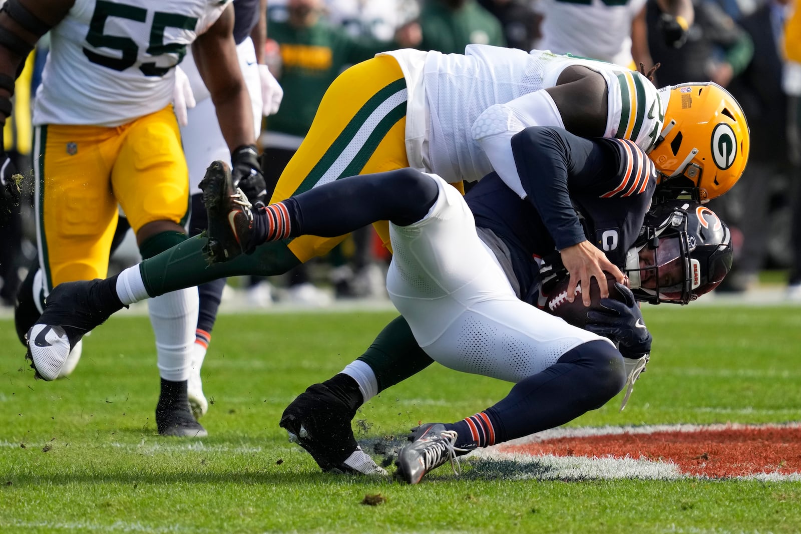 Green Bay Packers' Brenton Cox Jr. sacks Chicago Bears' Caleb Williams during the first half of an NFL football game Sunday, Nov. 17, 2024, in Chicago. (AP Photo/Nam Y. Huh)