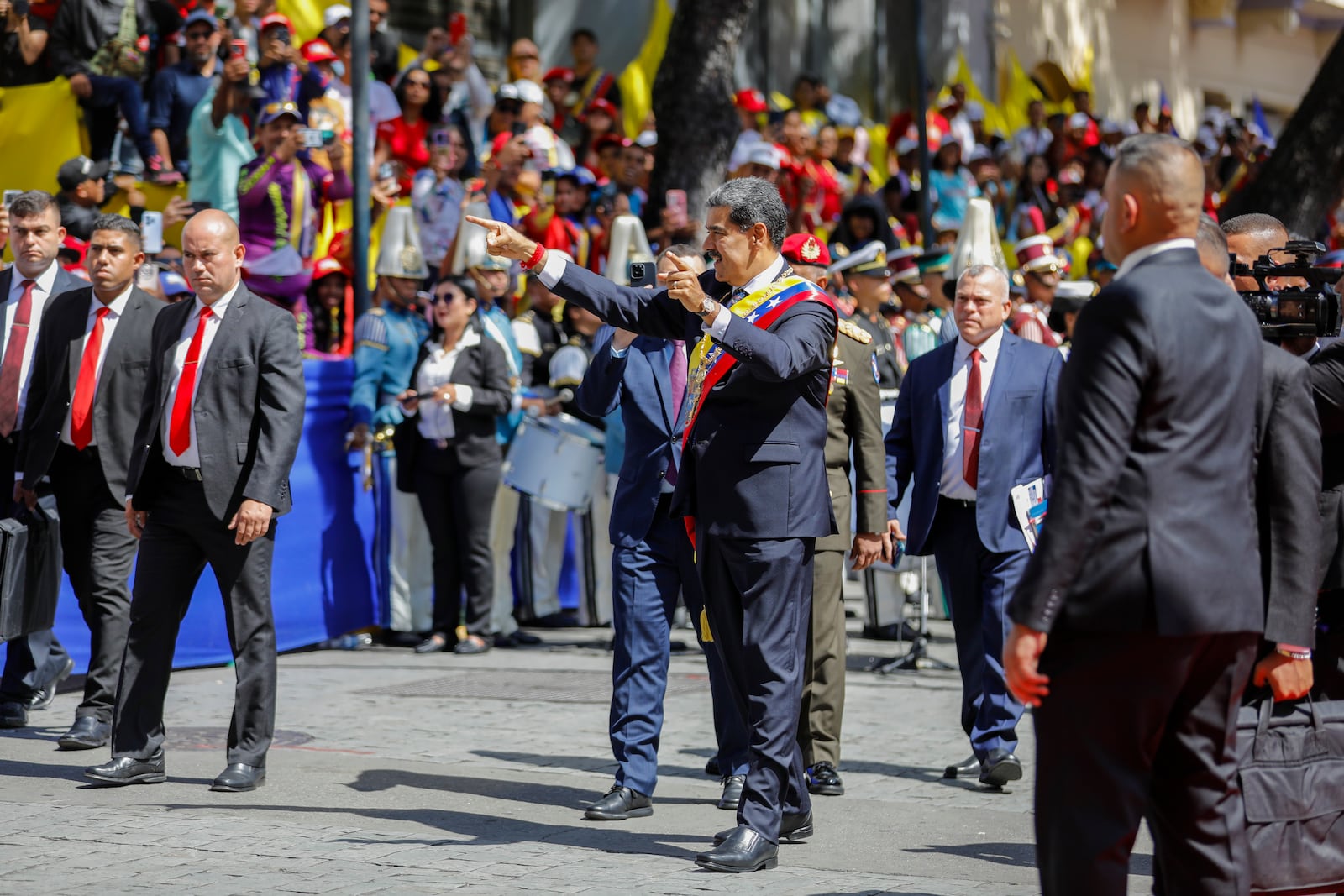 Venezuelan President Nicolas Maduro greets government supporters after being sworn in for a third term in Caracas, Venezuela, Friday, Jan. 10, 2025. (AP Photo/Cristian Hernandez)