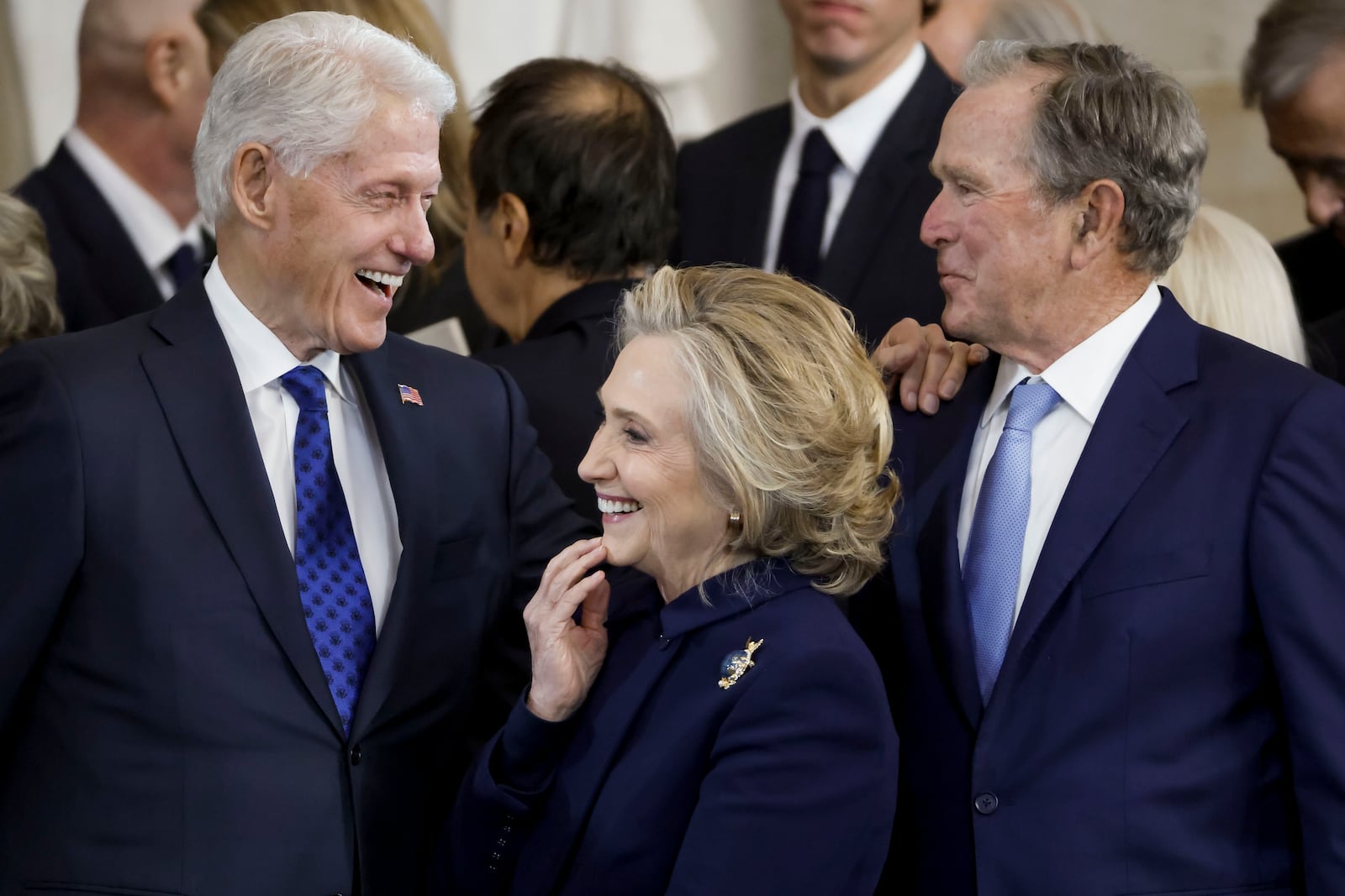 From left, former President Bill Clinton, former Secretary of State Hillary Clinton, and former President George W. Bush, speak following the 60th Presidential Inauguration for President Donald Trump, in the Rotunda of the U.S. Capitol in Washington, Monday, Jan. 20, 2025. (Shawn Thew/Pool photo via AP)