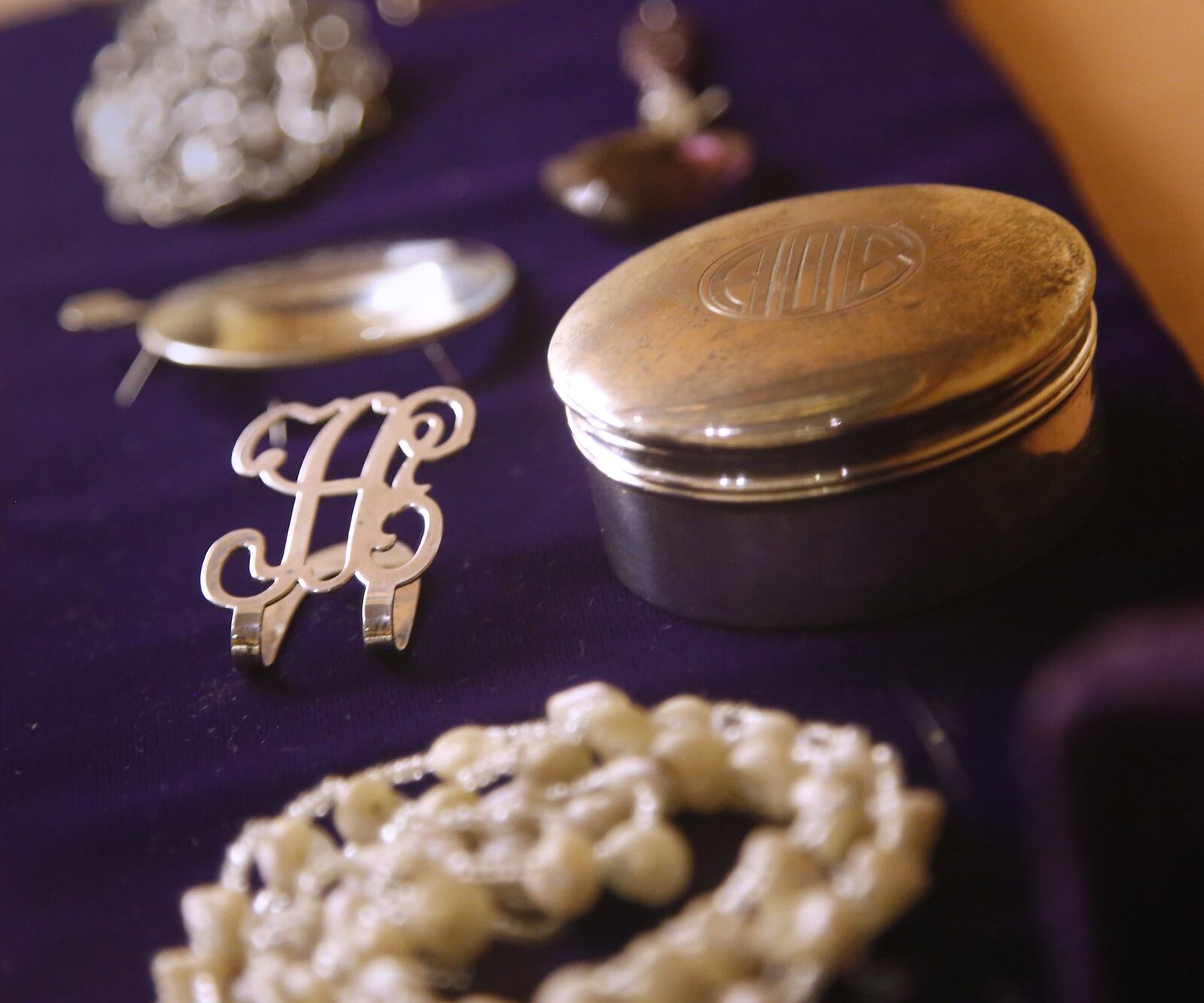 Annie Oakley liked fine things and was a proper Victorian woman in her private life. The beautiful tableware, china and lace she used in her daily life are displayed in cases at The Annie Oakley Center in Greenville, as are some of the necklaces and monogrammed broaches she wore. LISA POWELL / STAFF