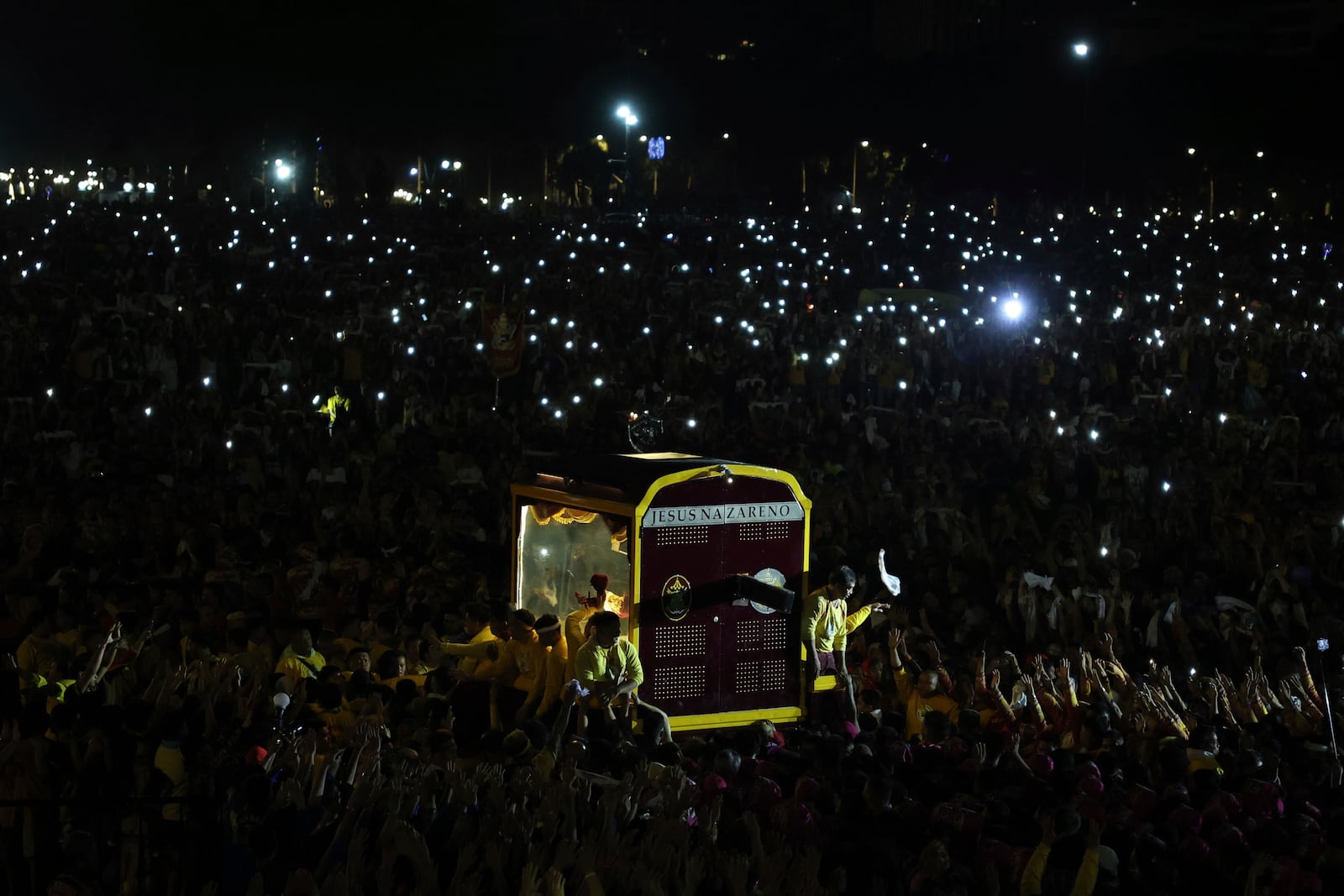 Devotees pull a glass-covered carriage carrying the image of Jesus Nazareno during its annual procession in Manila, Philippines, Thursday. Jan. 9, 2025. (AP Photo/Basilio Sepe)