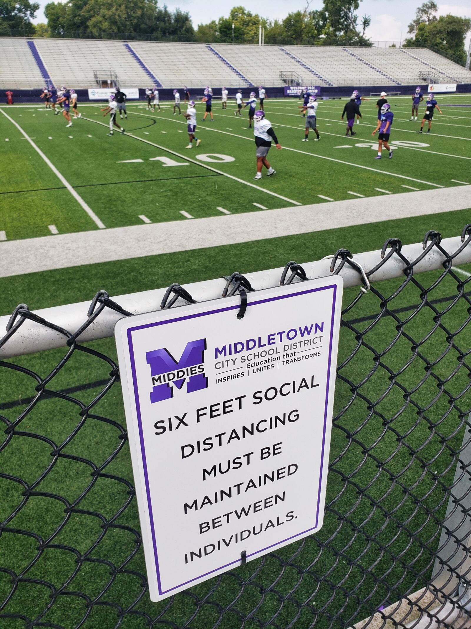 A sign posted at Barnitz Stadium warns visitors they must practice social distancing. NICK GRAHAM/STAFF