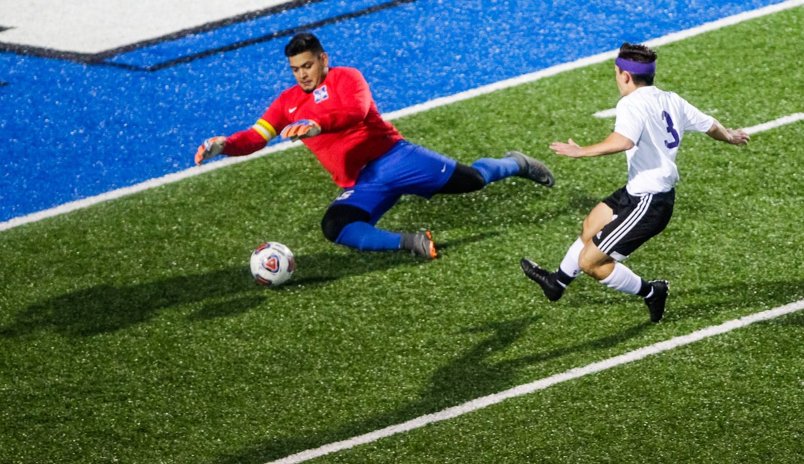 Hamilton goalkeeper Brian Cruz saves a shot attempt by Middletown’s Nick Thornton during a 4-2 Division I sectional victory by HHS on Monday night at Virgil Schwarm Stadium in Hamilton. NICK GRAHAM/STAFF