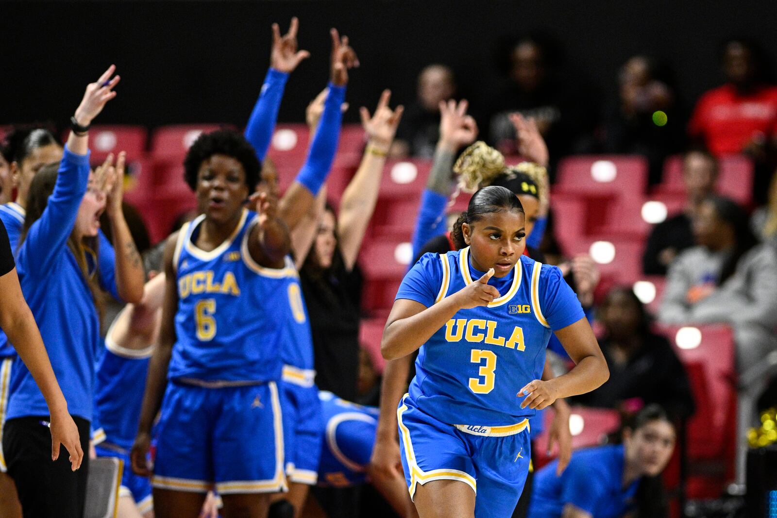 UCLA guard Londynn Jones (3) gestures after she made a 3-point basket during the second half of an NCAA college basketball game against Maryland, Sunday, Jan. 26, 2025, in College Park, Md. (AP Photo/Nick Wass)