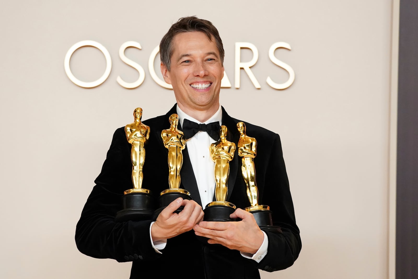 Sean Baker, winner of the awards for best original screenplay, best film editing, best director, and best picture for "Anora," poses in the press room at the Oscars on Sunday, March 2, 2025, at the Dolby Theatre in Los Angeles. (Photo by Jordan Strauss/Invision/AP) poses in the press room at the Oscars on Sunday, March 2, 2025, at the Dolby Theatre in Los Angeles. (Photo by Jordan Strauss/Invision/AP)