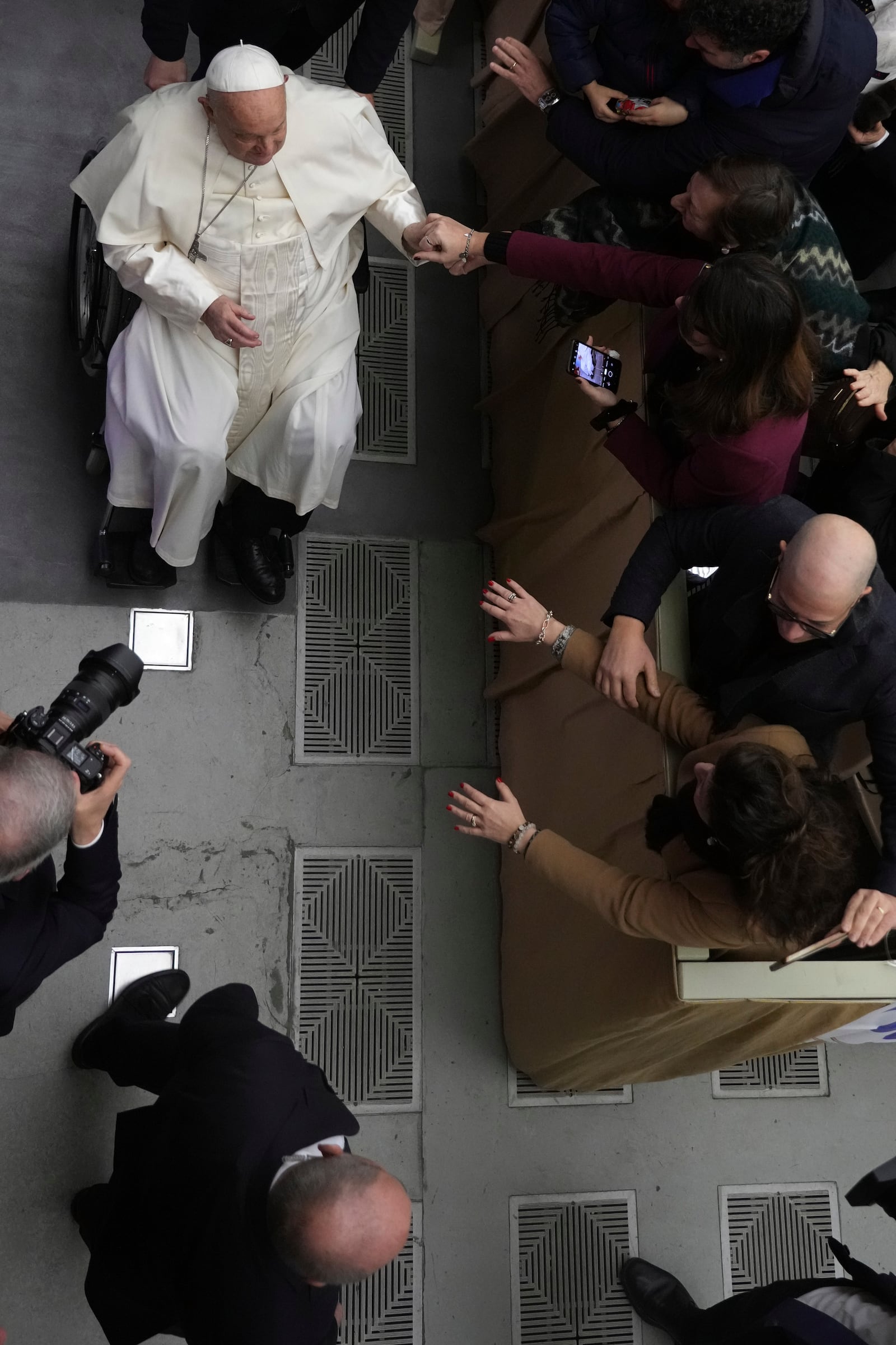 Pope Francis leaves after an audience with Catholic associations of teachers and students' parents in the Paul VI Hall, at the Vatican, Saturday, Jan. 4, 2025. (AP Photo/Alessandra Tarantino)