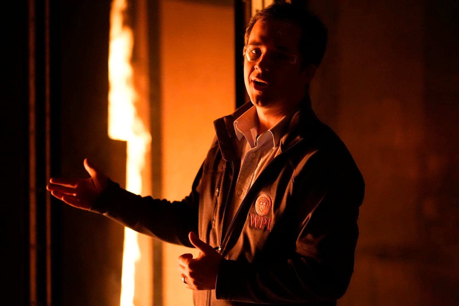 James Urban, assistant professor in the department of Fire Protection Engineering at Worcester Polytechnic Institute, comments during a controlled burn in a lab, Wednesday, Jan. 15, 2025, in Worcester, Mass. (AP Photo/Robert F. Bukaty)