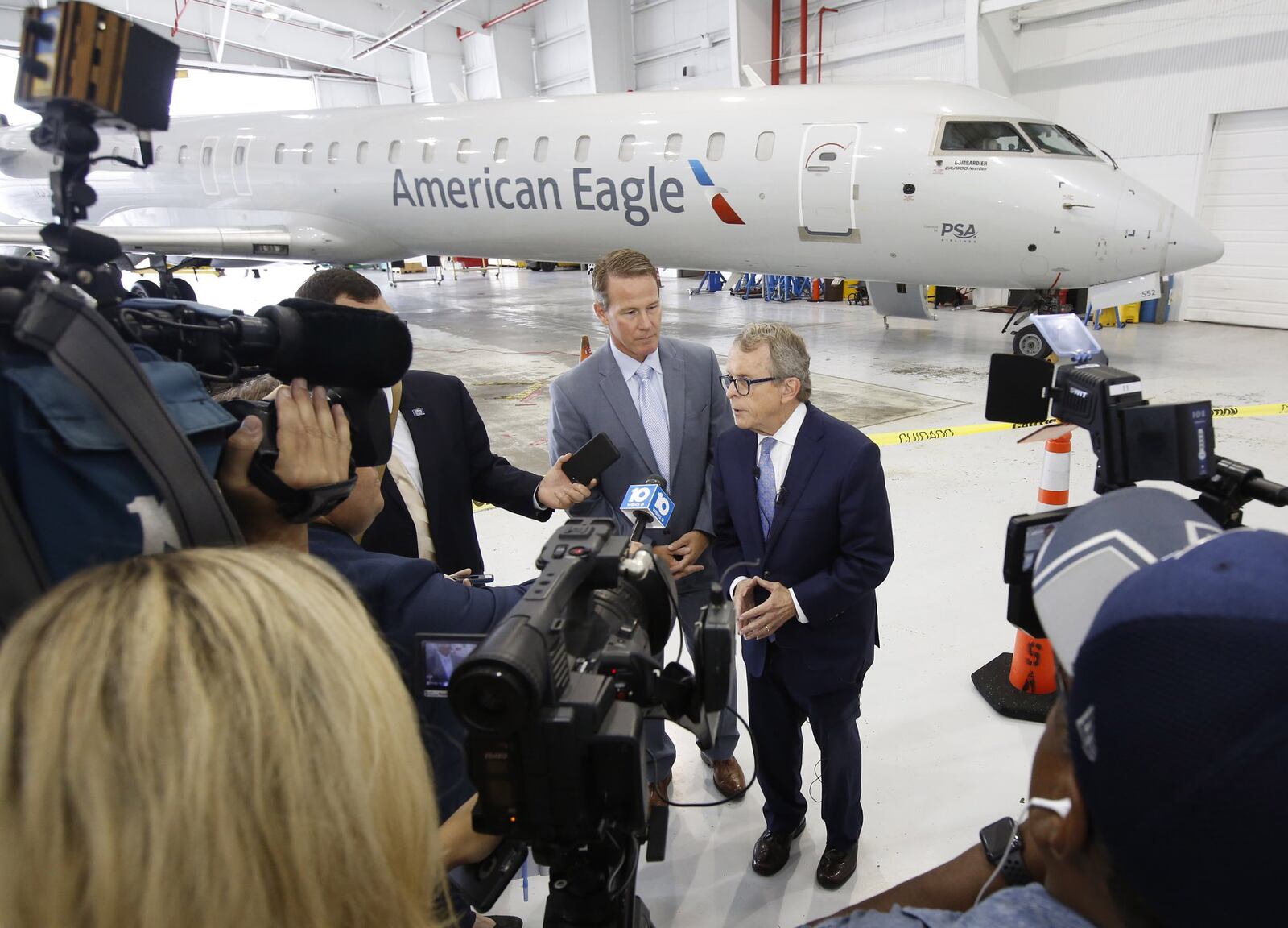 Republican candidate for Ohio Governor, Ohio Attorney General Mike DeWine, right, with running mate, Ohio Secretary of State Jon Husted, during a Dayton Area Chamber of Commerce meeting on Thursday, August 16. TY GREENLEES / STAFF