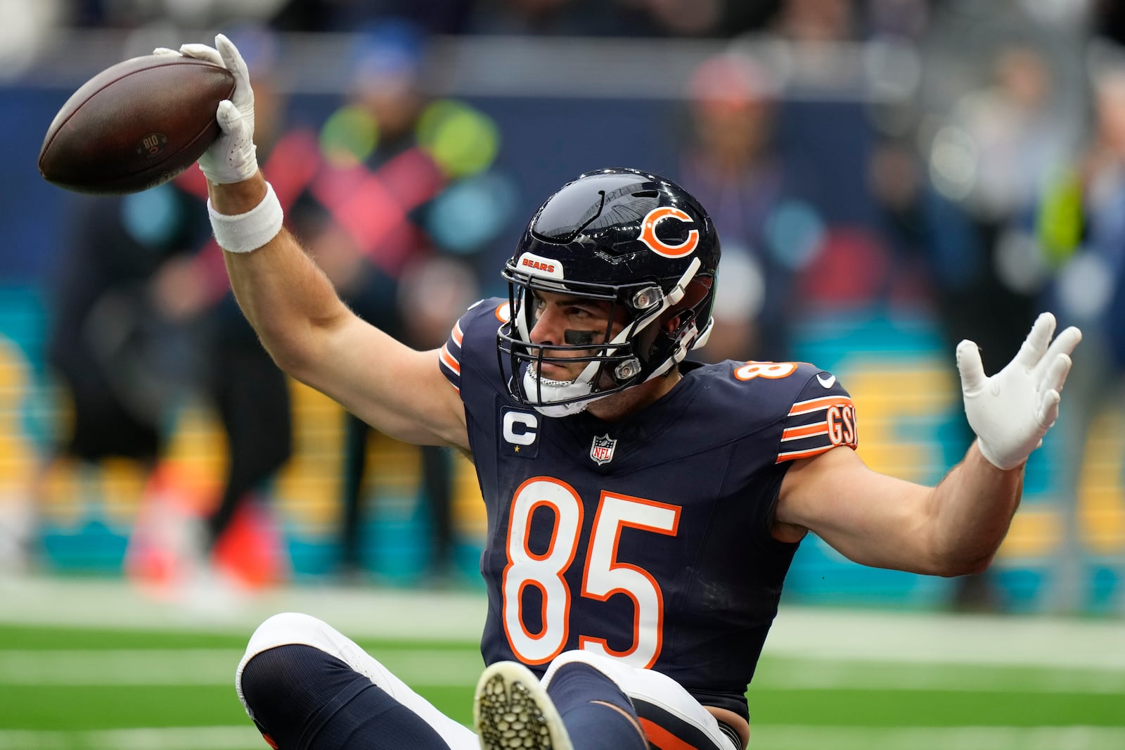 Chicago Bears tight end Cole Kmet (85) celebrates after scoring the first touch down in the first quarter of an NFL football game at the Tottenham Hotspur stadium between the Jacksonville Jaguars and Chicago Bears in London, Sunday, Oct. 13, 2024. (AP Photo/Alastair Grant)