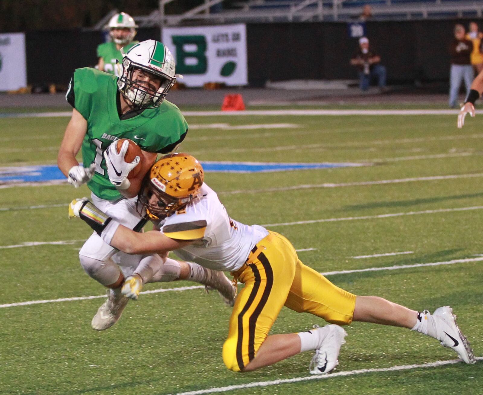 Josh Hegemann of Badin (left) is met by Aidan Plate of Alter. Badin defeated visiting Alter 42-7 in a Week 6 high school football game at Virgil Schwarm Stadium on Friday, Oct. 4, 2019. MARC PENDLETON / STAFF