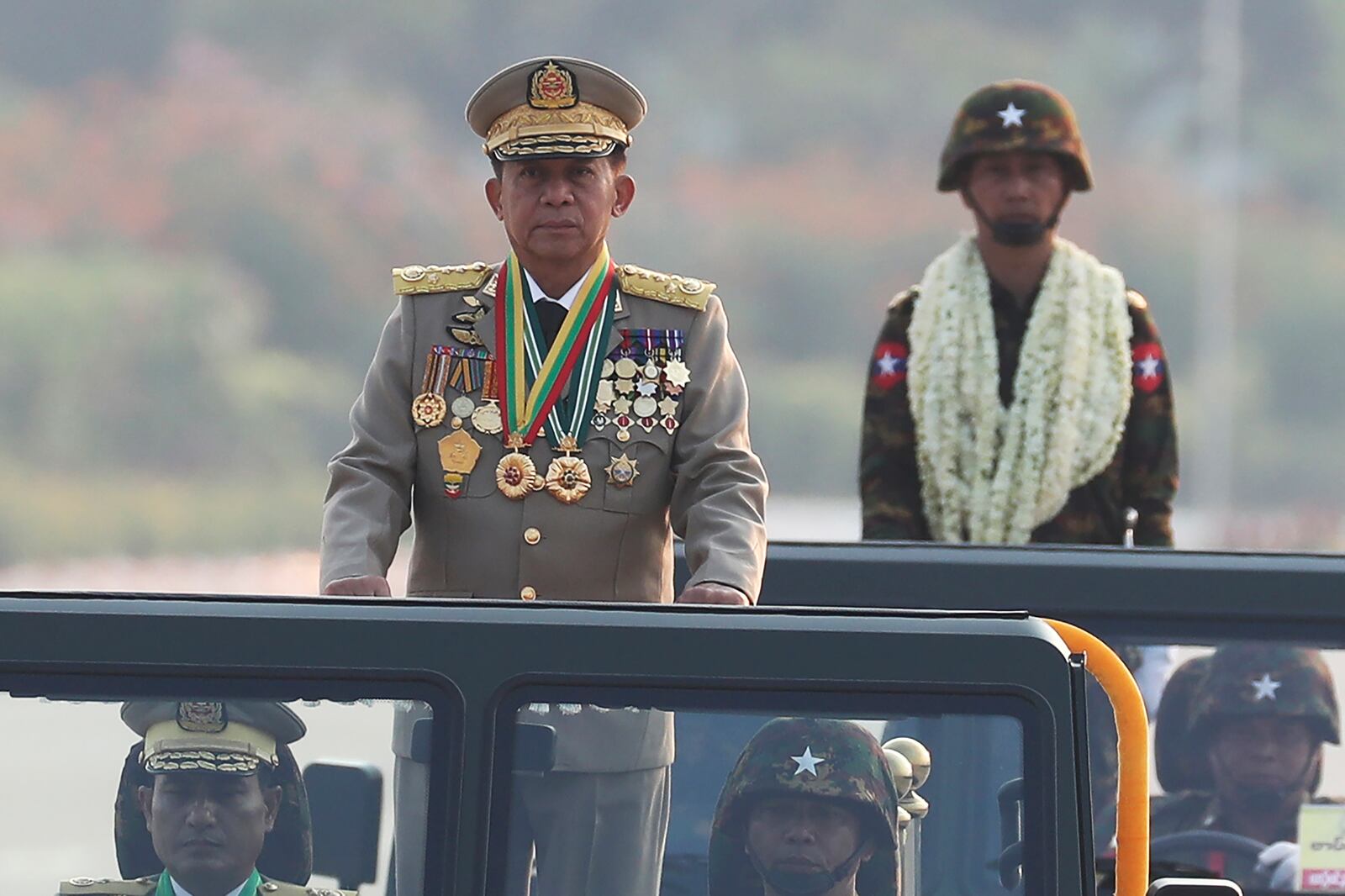 FILE - Myanmar military leader Senior Gen. Min Aung Hlaing, left, head of the military council, inspects officers during a parade to commemorate Myanmar's 78th Armed Forces Day in Naypyitaw, Myanmar, on March 27, 2023. (AP Photo/Aung Shine Oo)