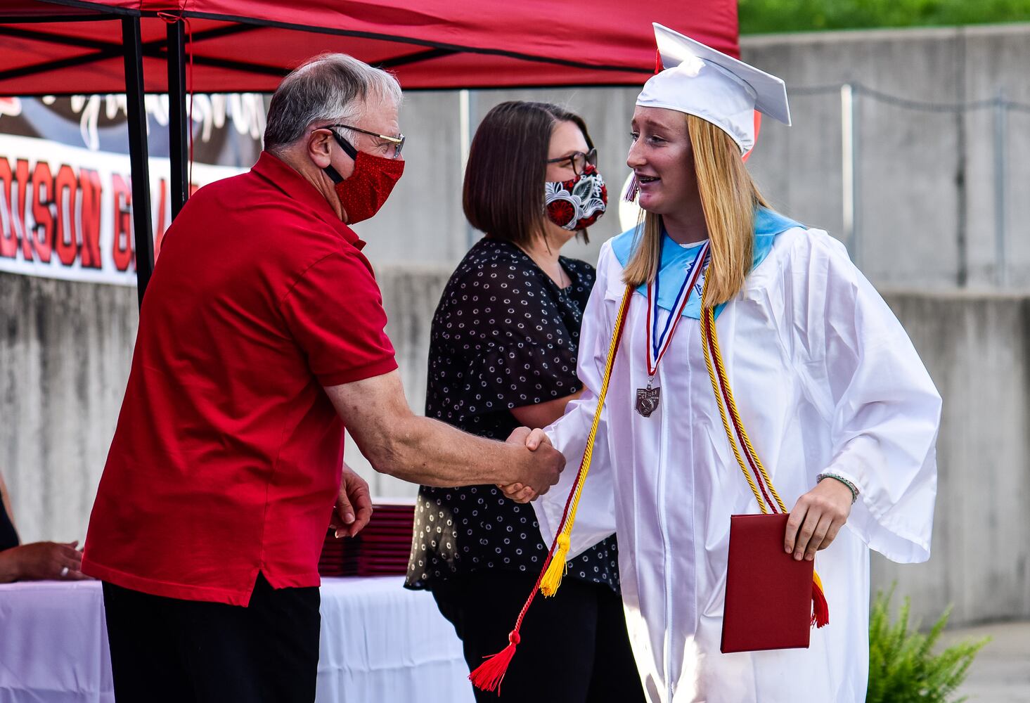 Madison High School drive-thru graduation ceremony at Land of Illusion