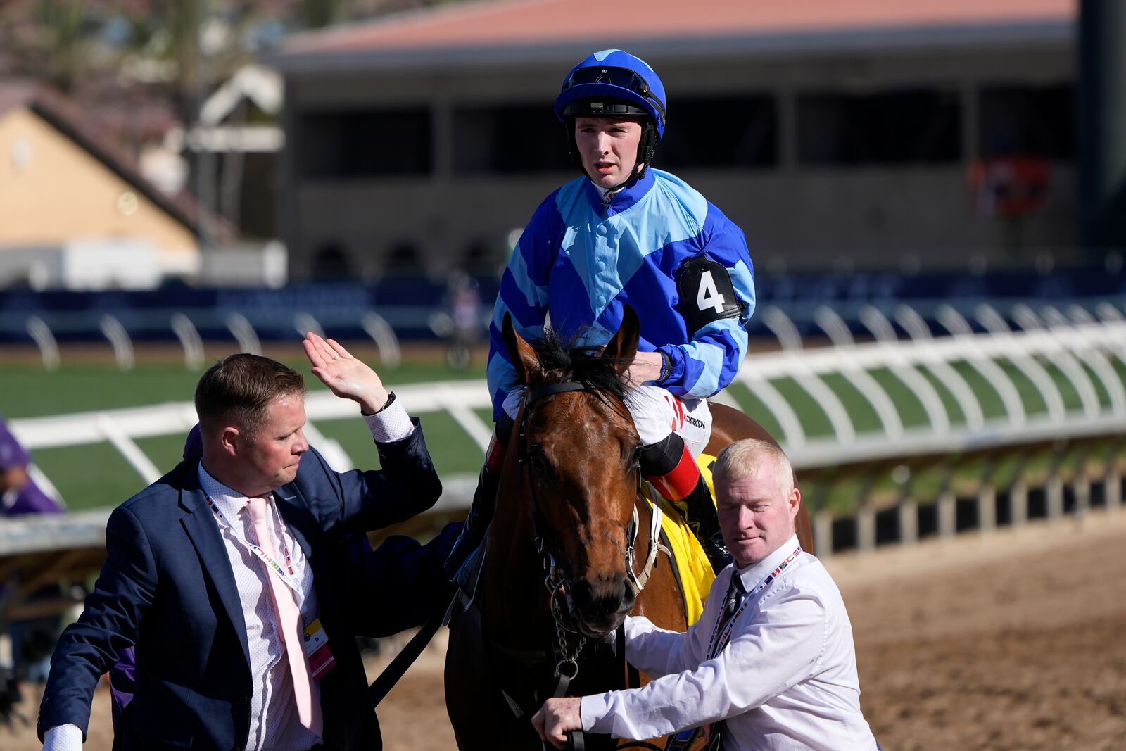 Colin Keane, top, celebrates while riding Magnum Force after winning the Breeders' Cup Juvenile Turf Sprint horse race at Santa Anita Park in Del Mar, Calif., Friday, Nov. 1, 2024. (AP Photo/Gregory Bull)