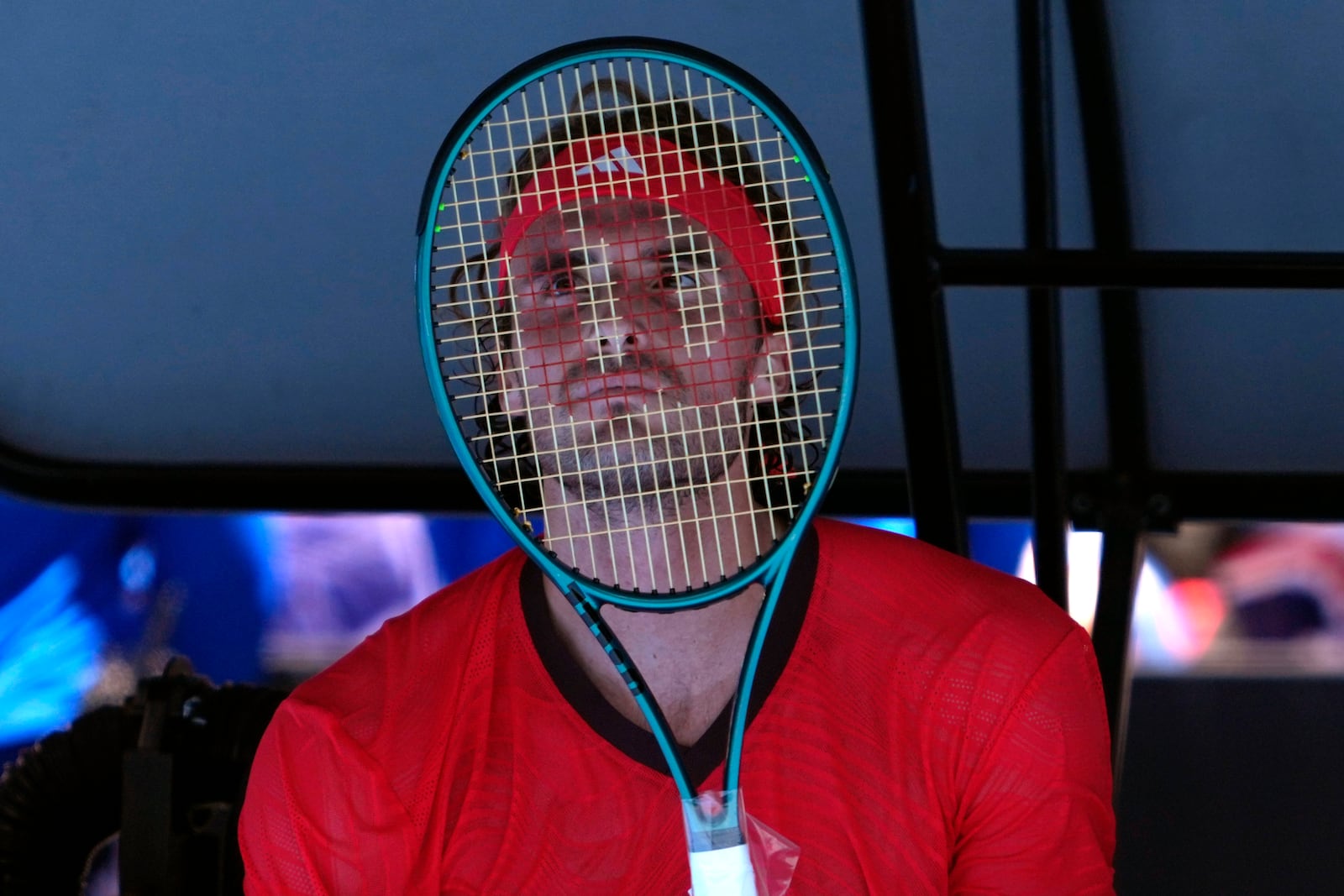 Stefanos Tsitsipas of Greece reacts during a break in his first round match against Alex Michelsen of the U.S. at the Australian Open tennis championship in Melbourne, Australia, Monday, Jan. 13, 2025. (AP Photo/Ng Han Guan)