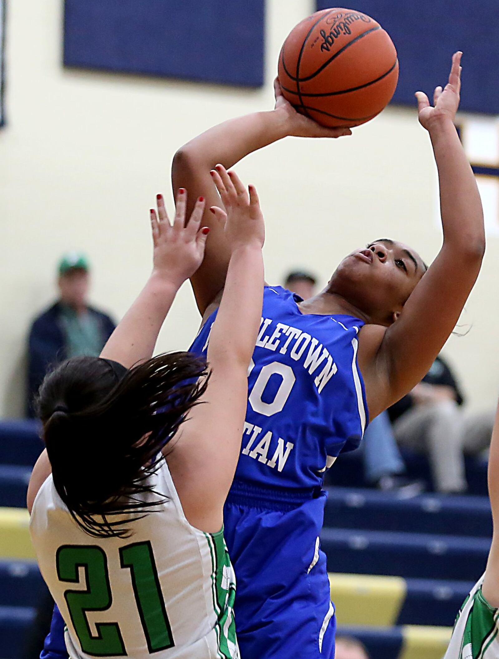 Middletown Christian’s Aubriana Bellard shoots over Fayetteville’s Haley Moore during their Division IV sectional contest at Monroe on Tuesday night. CONTRIBUTED PHOTO BY E.L. HUBBARD