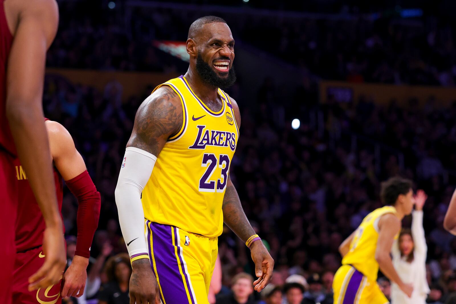 Los Angeles Lakers forward LeBron James celebrates after scoring during the second half of an NBA basketball game against the Cleveland Cavaliers Tuesday, Dec. 31, 2024, in Los Angeles. (AP Photo/Ryan Sun)