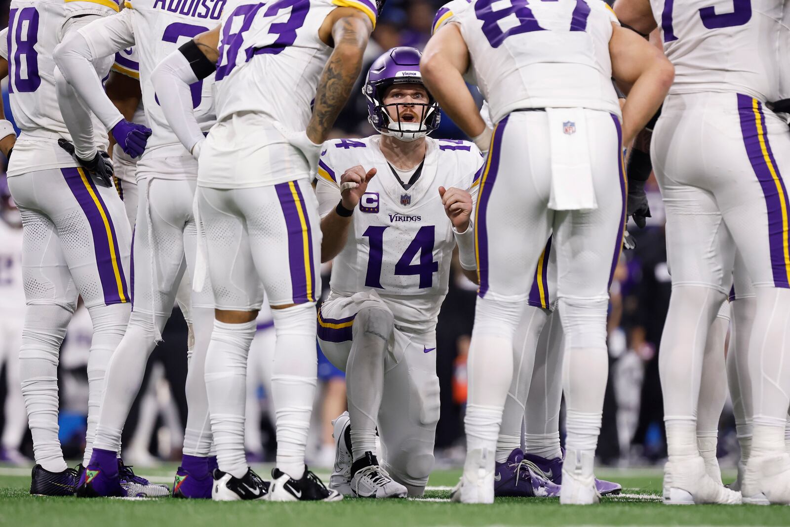 FILE - Minnesota Vikings quarterback Sam Darnold (14) calls a play in a huddle during the second half of an NFL football game against the Detroit Lions, Sunday, Jan. 5, 2025, in Detroit. (AP Photo/Rey Del Rio, File)