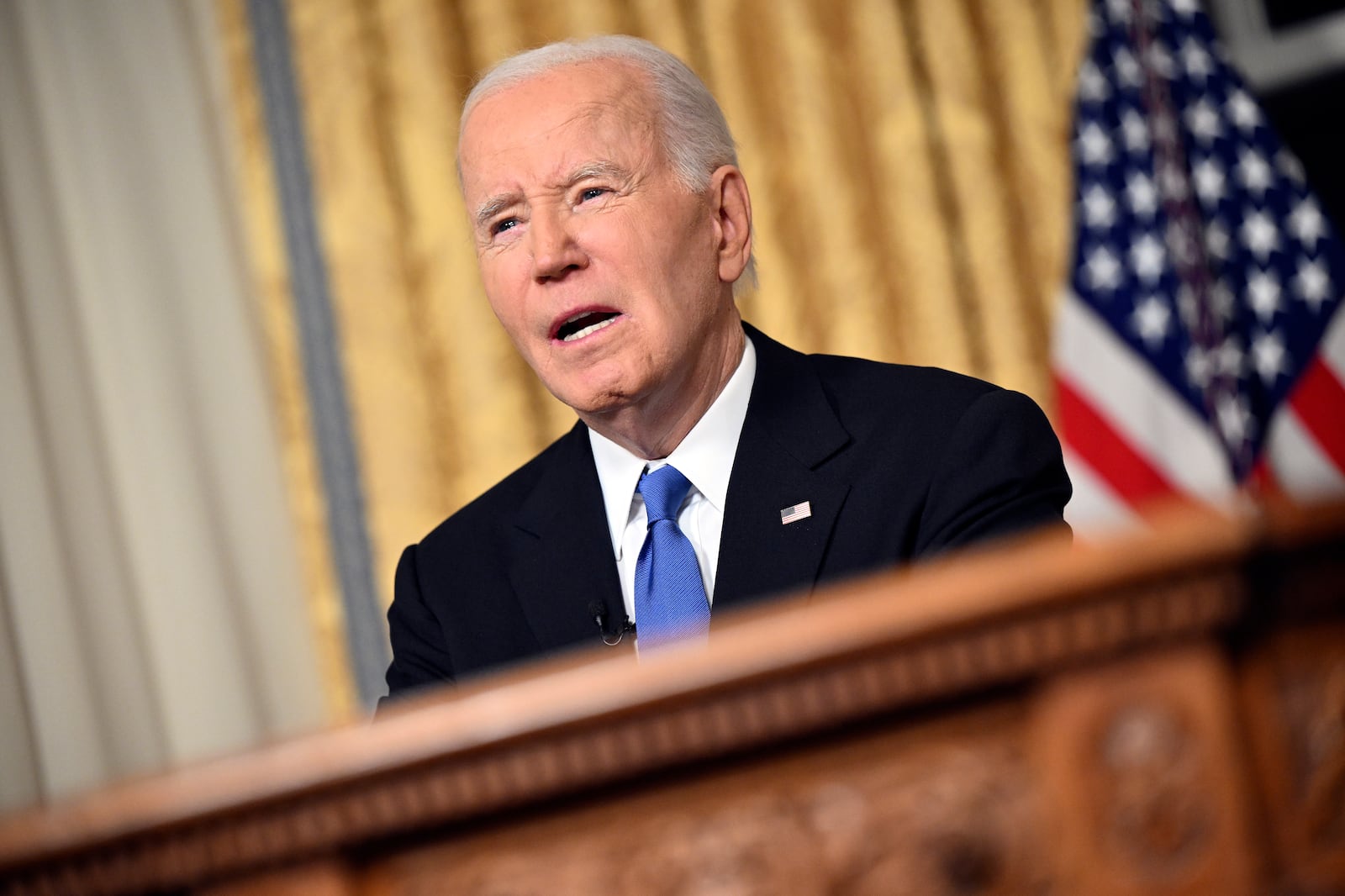 President Joe Biden speaks from the Oval Office of the White House as he gives his farewell address Wednesday, Jan. 15, 2025, in Washington. (Mandel Ngan/Pool via AP)