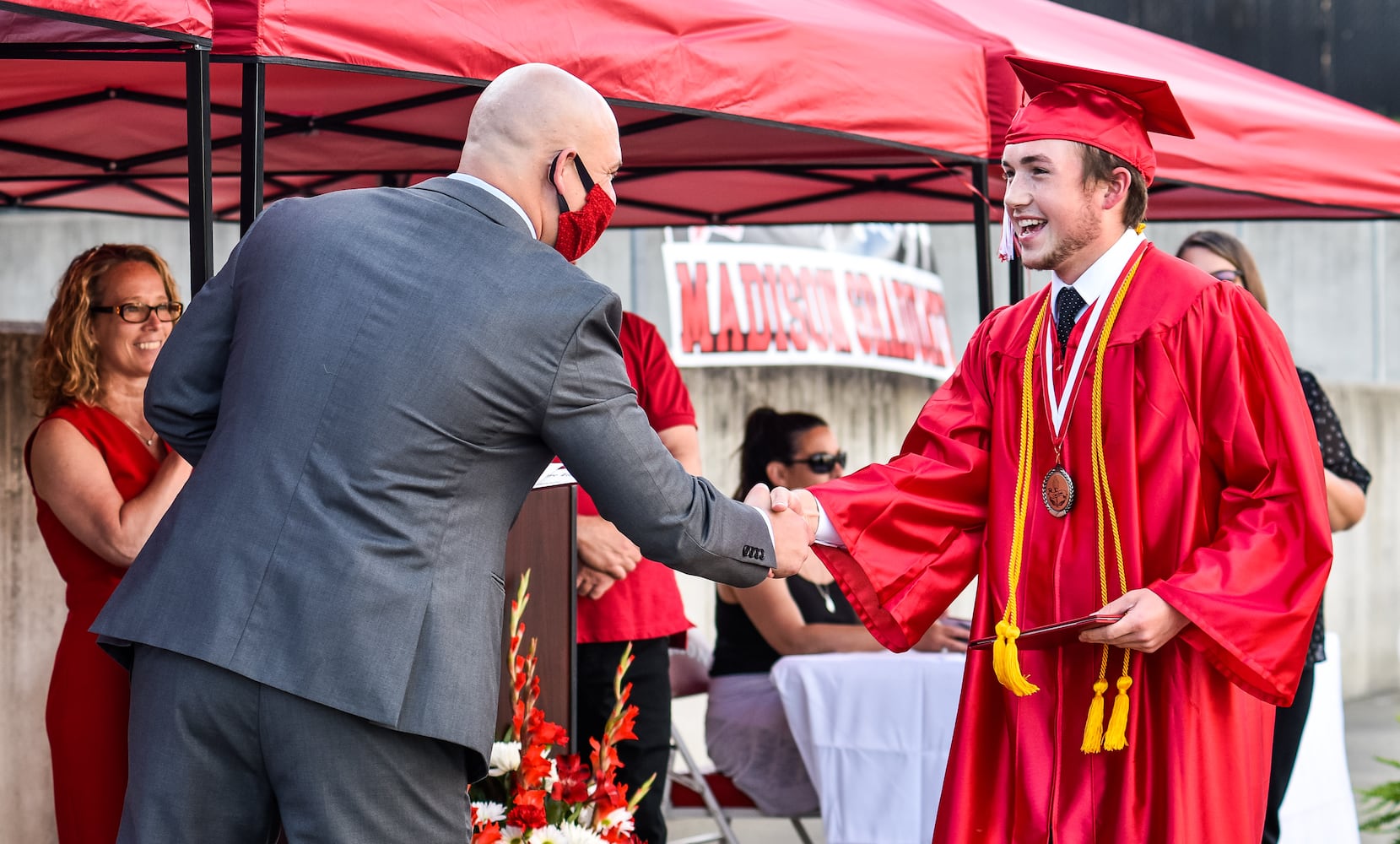 Madison High School drive-thru graduation ceremony at Land of Illusion