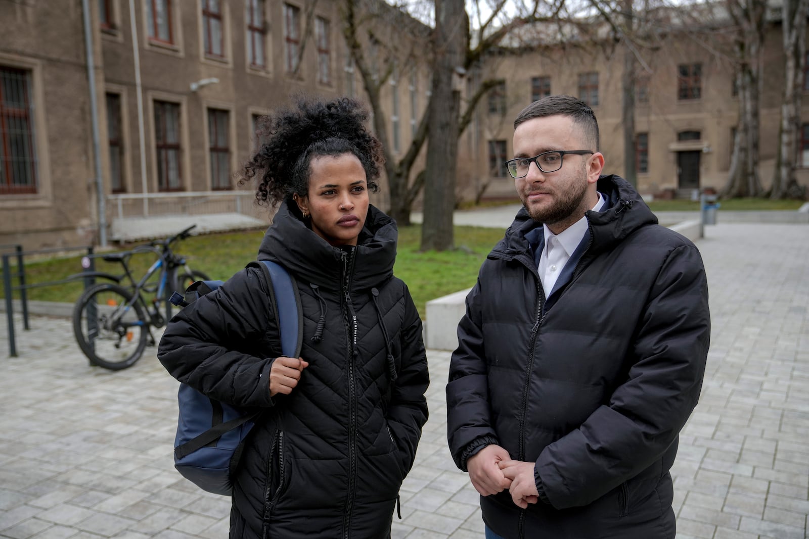 Haben, 26, Eritrean immigrant who has lived and worked in Magdeburg for 7 years, left, and Saeed 25, Syrian immigrant who has lived and worked in Magdeburg for 6 years stand for a photo in a street, in Magdeburg, Germany, Friday, Feb. 7, 2025. (AP Photo/Ebrahim Noroozi)