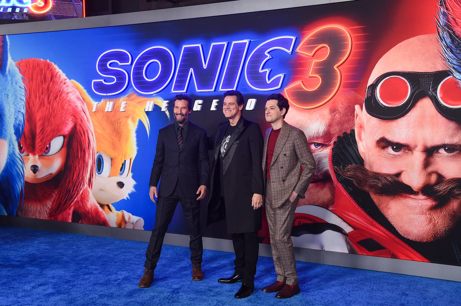 Keanu Reeves, from left, Jim Carrey, and Ben Shwartz arrive at the premiere of "Sonic The Hedgehog 3" on Monday, Dec. 16, 2024, at TCL Chinese Theatre in Los Angeles. (Photo by Richard Shotwell/Invision/AP)