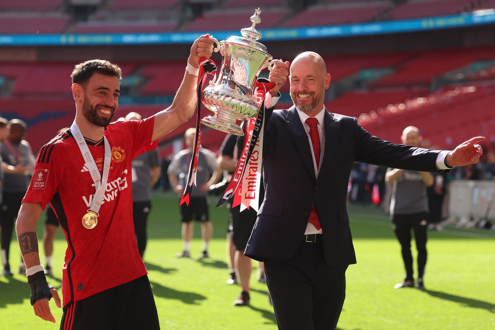 FILE - Manchester United's head coach Erik ten Hag and Manchester United's Bruno Fernandes pose with the trophy after winning the English FA Cup final soccer match between Manchester City and Manchester United at Wembley Stadium in London, Saturday, May 25, 2024. (AP Photo/Ian Walton, File)