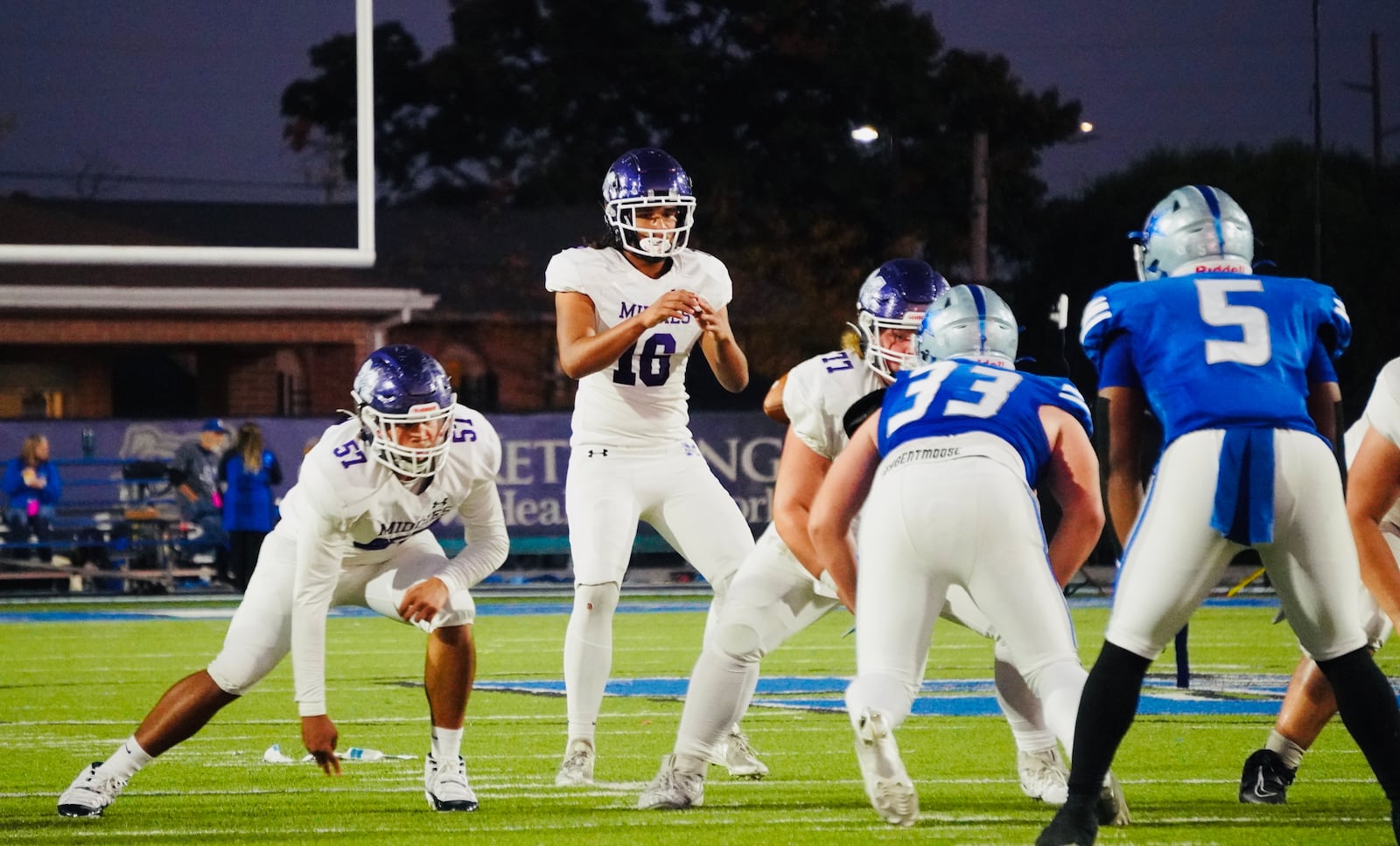 Middletown quarterback Jason Bourne takes a snap against Hamilton in the Butler Bowl on Friday night at Virgil Schwarm Stadium. Chris Vogt/CONTRIBUTED