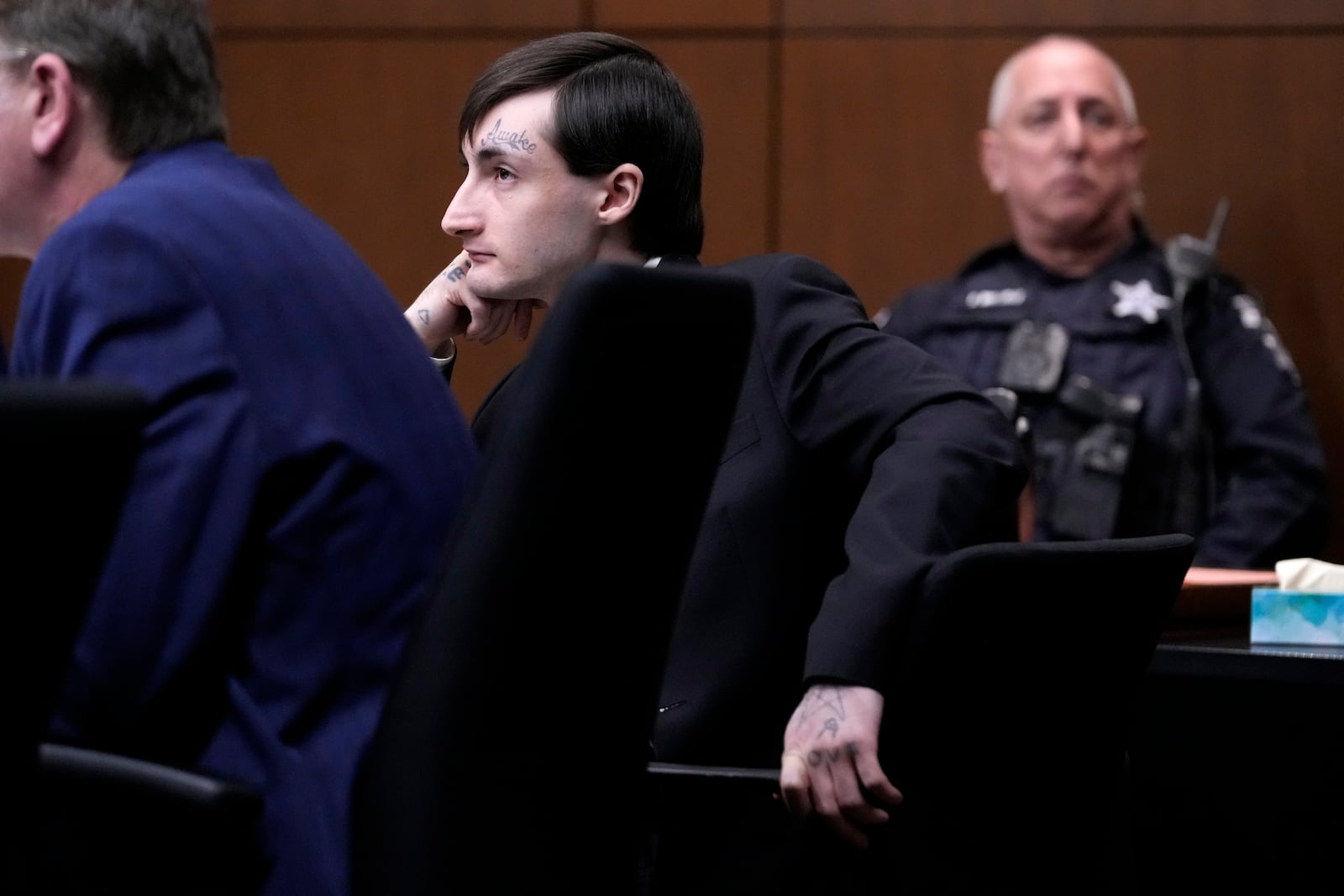 Robert E. Crimo III., center, watches the jury selection process during the first day of the trial of Robert E. Crimo III., at the Lake County Courthouse, Waukegan, Ill., Monday, Feb. 24, 2025. (AP Photo/Nam Y. Huh, Pool)