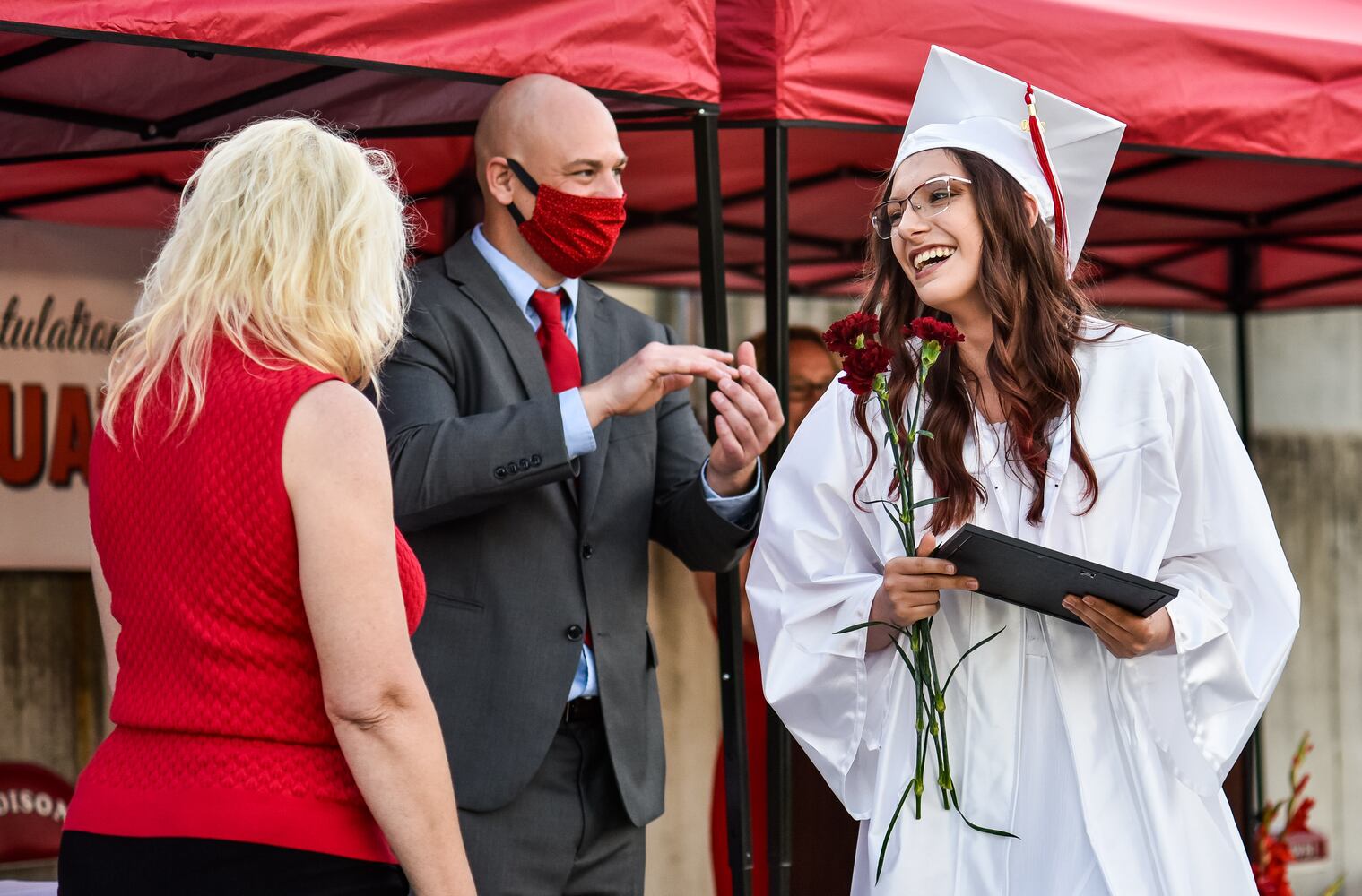 Madison High School drive-thru graduation ceremony at Land of Illusion