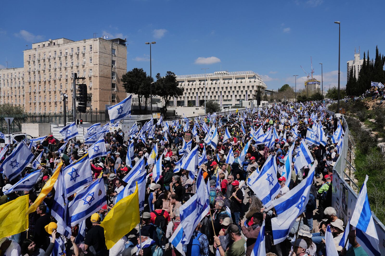 People protest a outside the Knesset, Israel's parliament, in Jerusalem on Sunday, March 23, 2025, as the Israeli cabinet is set to hold a no-confidence vote against Attorney General Gali Baharav-Miara. (AP Photo/Ohad Zwigenberg)